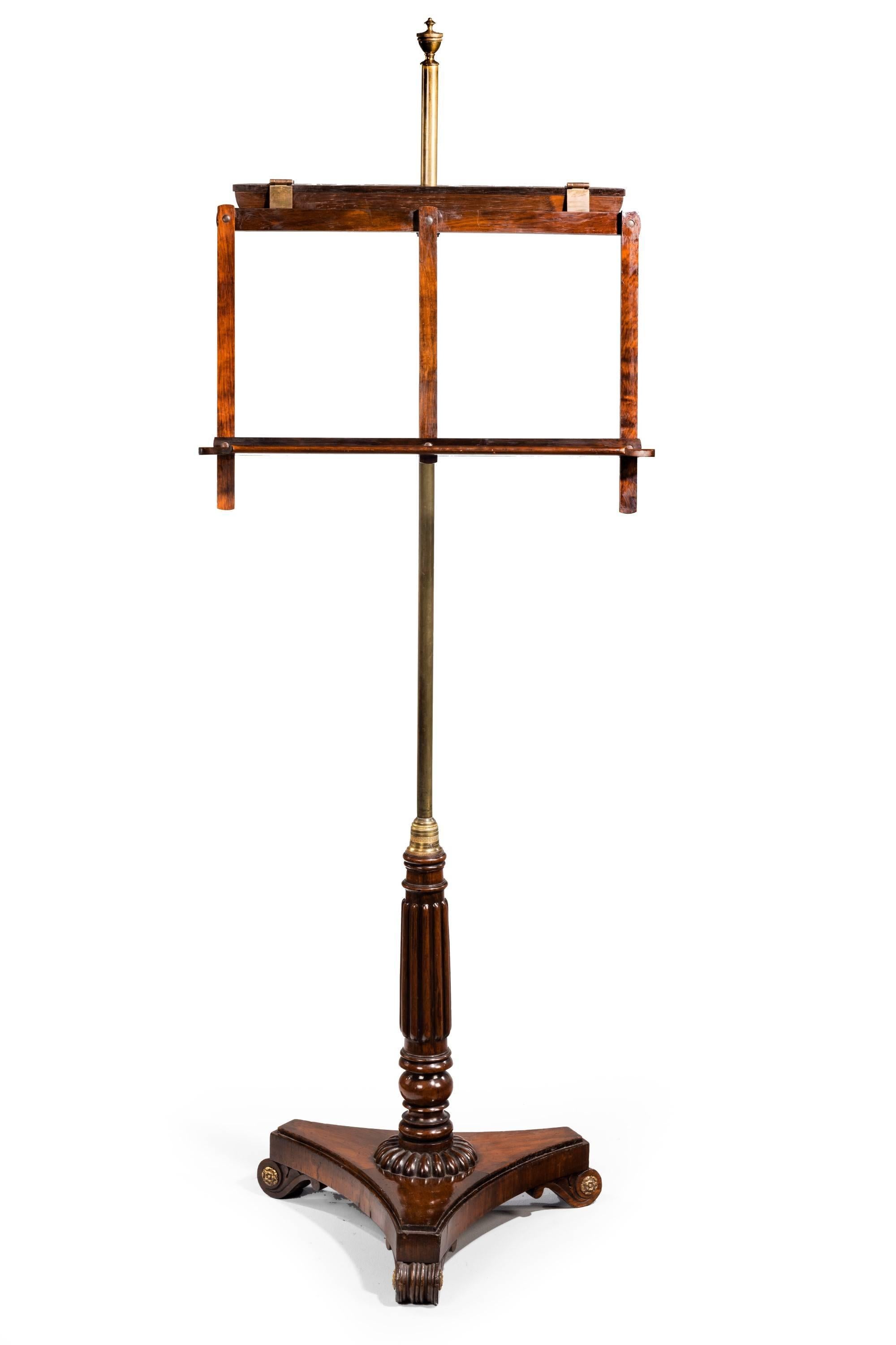 Typical of Gillows of Lancaster an elegant Regency period music stand. Fine slender support. Adjustable top section over a three-part base. Excellent overall condition.