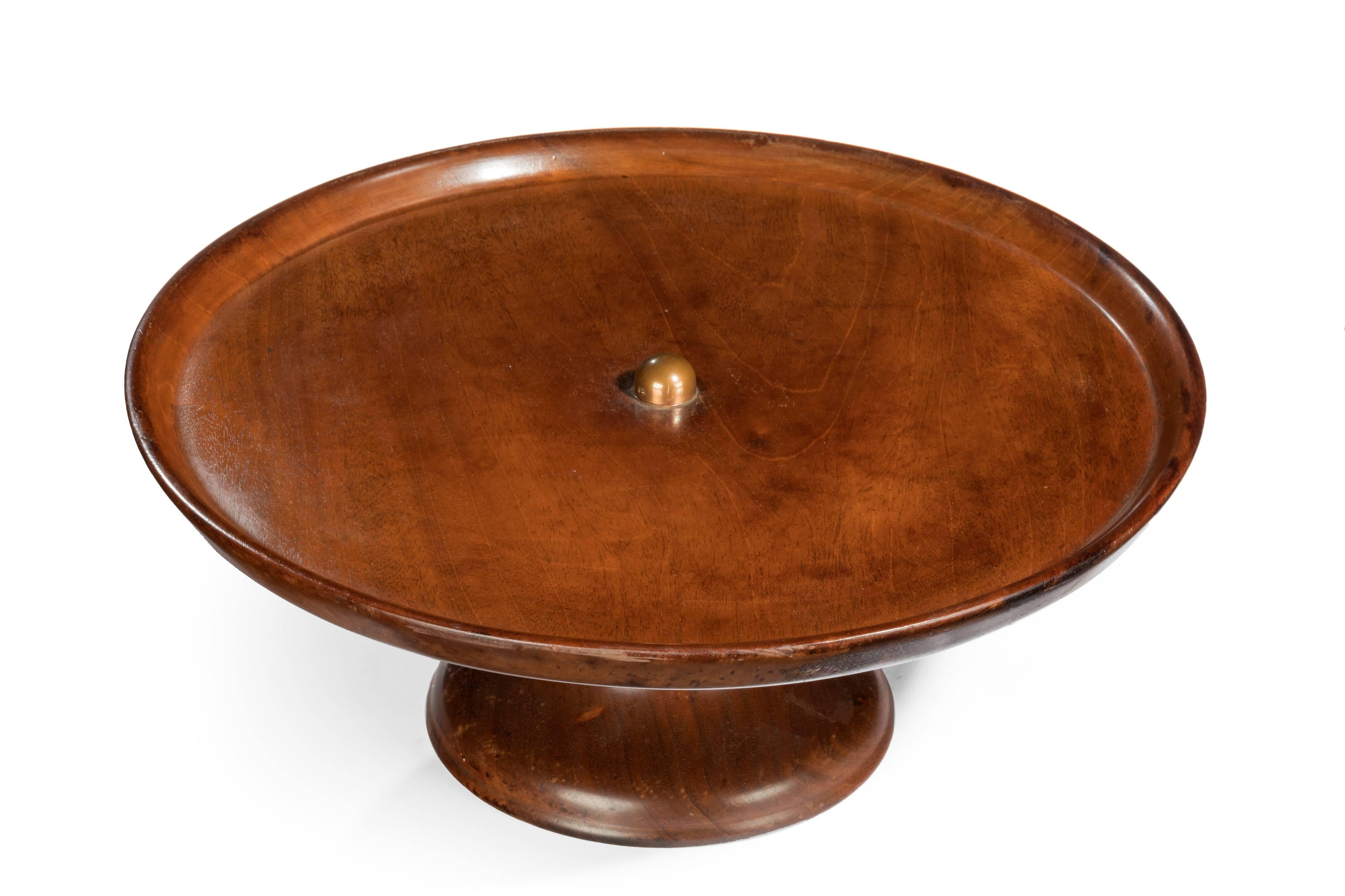 A mahogany lazy Susan. The top a single well turned piece of timber finely figured. Original polish.