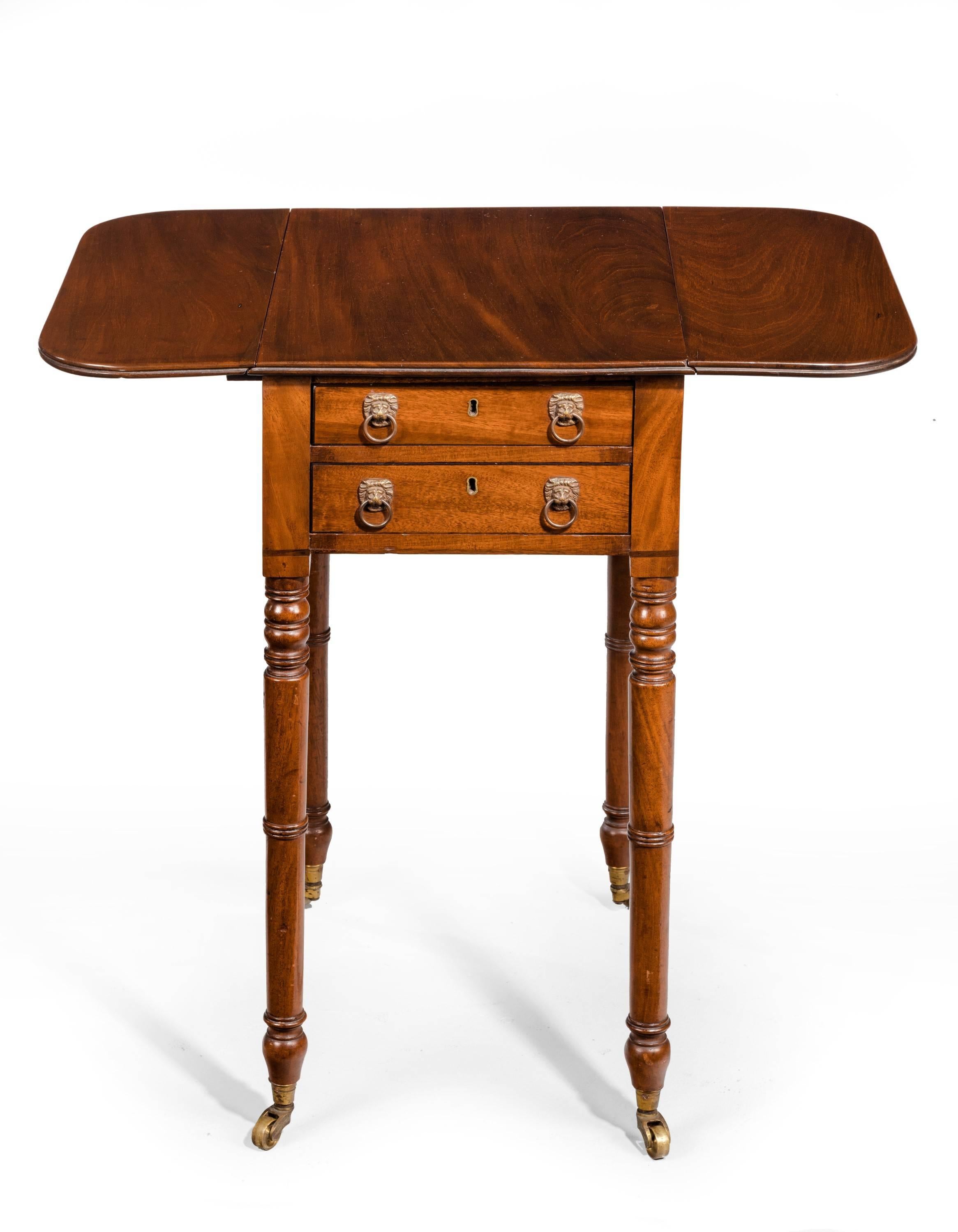 A fine quality and unusually small George III period mahogany Pembroke table. With two drawers to one side and dummy drawers to the reverse. Excellent overall workmanship. The top with a double reeded edge. Finely turned supports. Original shoes and