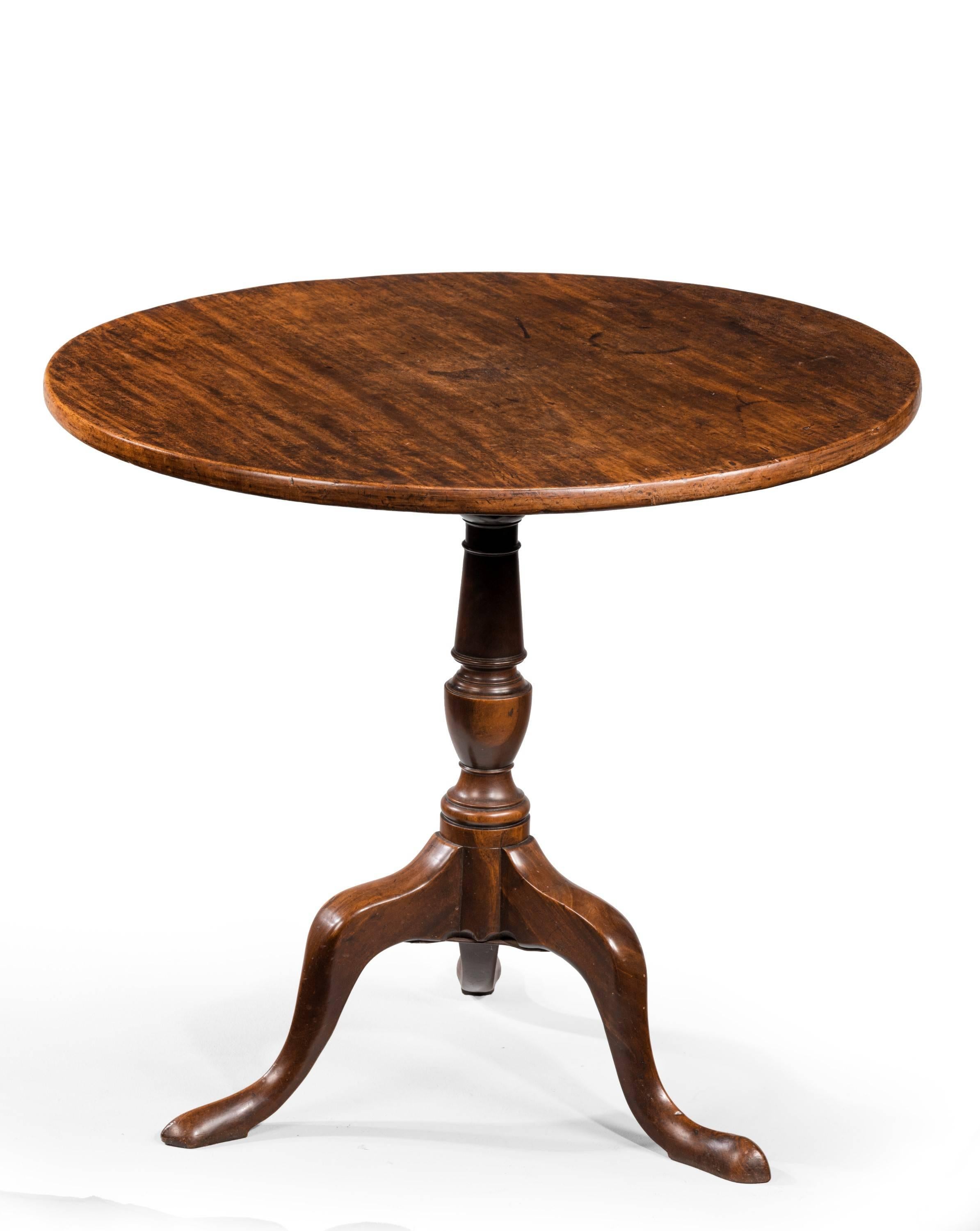 A good late 18th century mahogany tilt table on a well turned supports. Cabriole legs. Excellent overall color and patina.