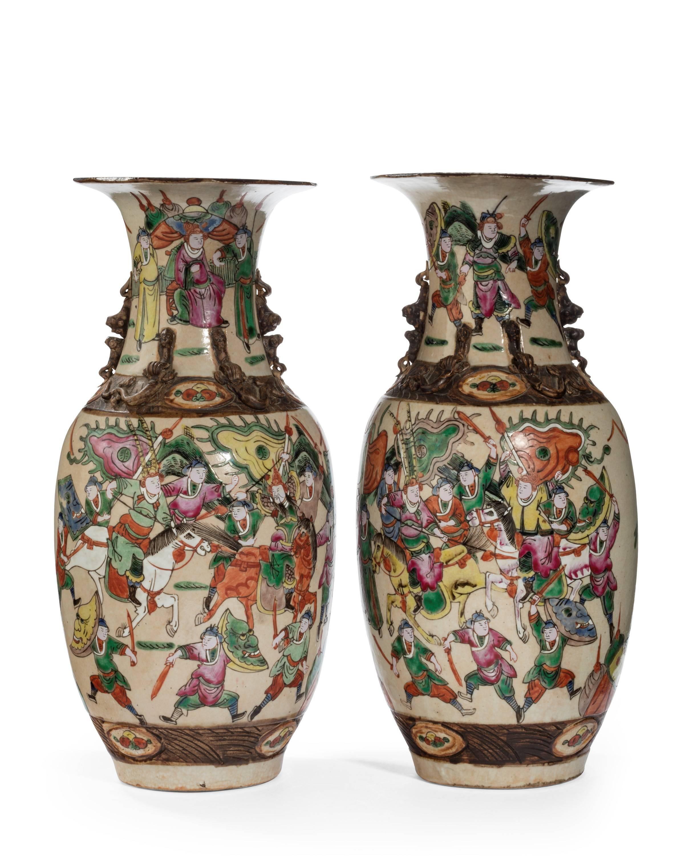 A good pair of Chinese figural polychrome crackleware vases. The upper section with animals and figurines in relief. Excellent overall condition.
