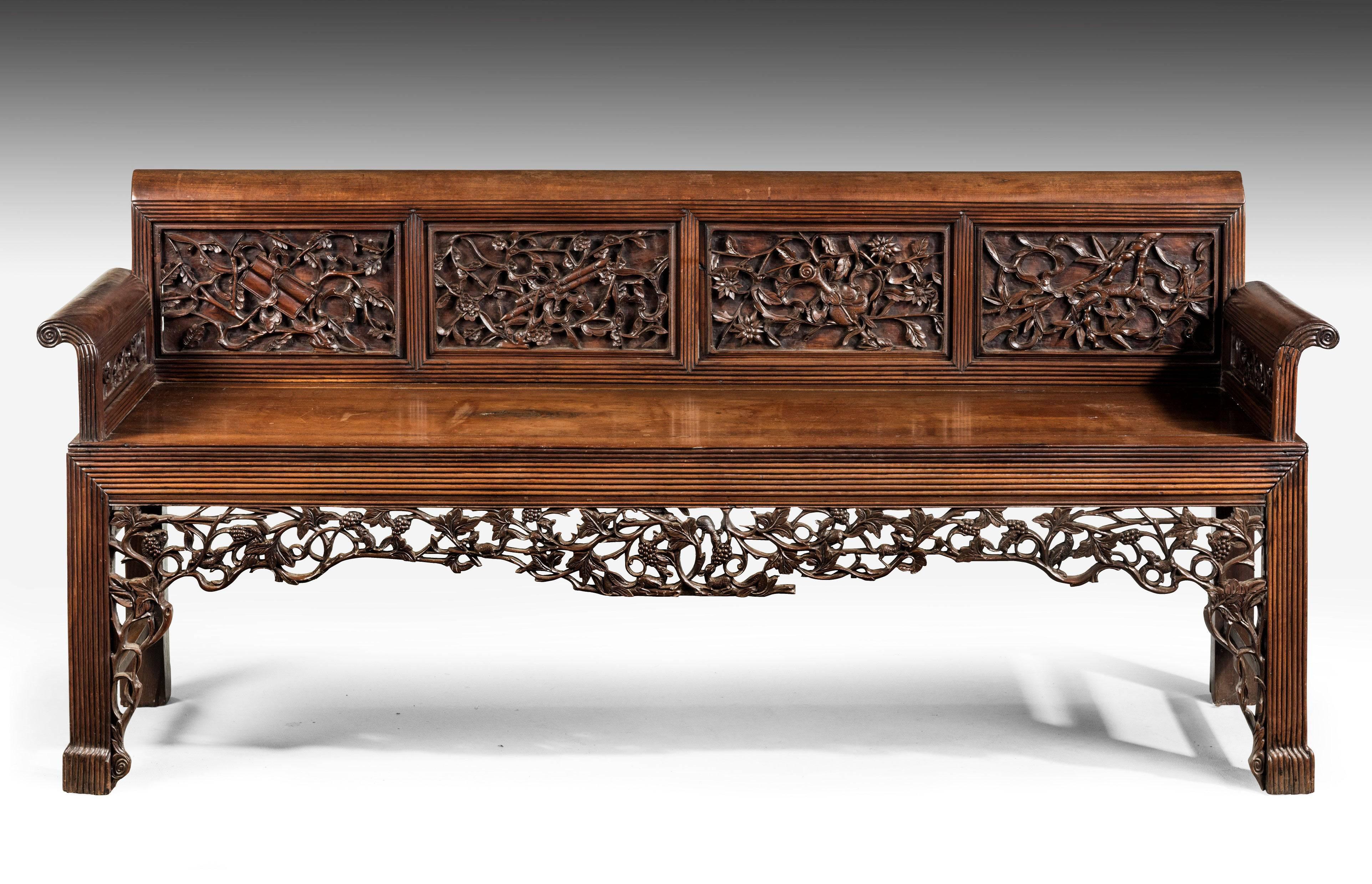 A fine and rare mid-19th century Chinese hardwood sofa with beautifully carved and finely executed details. Excellent overall condition.