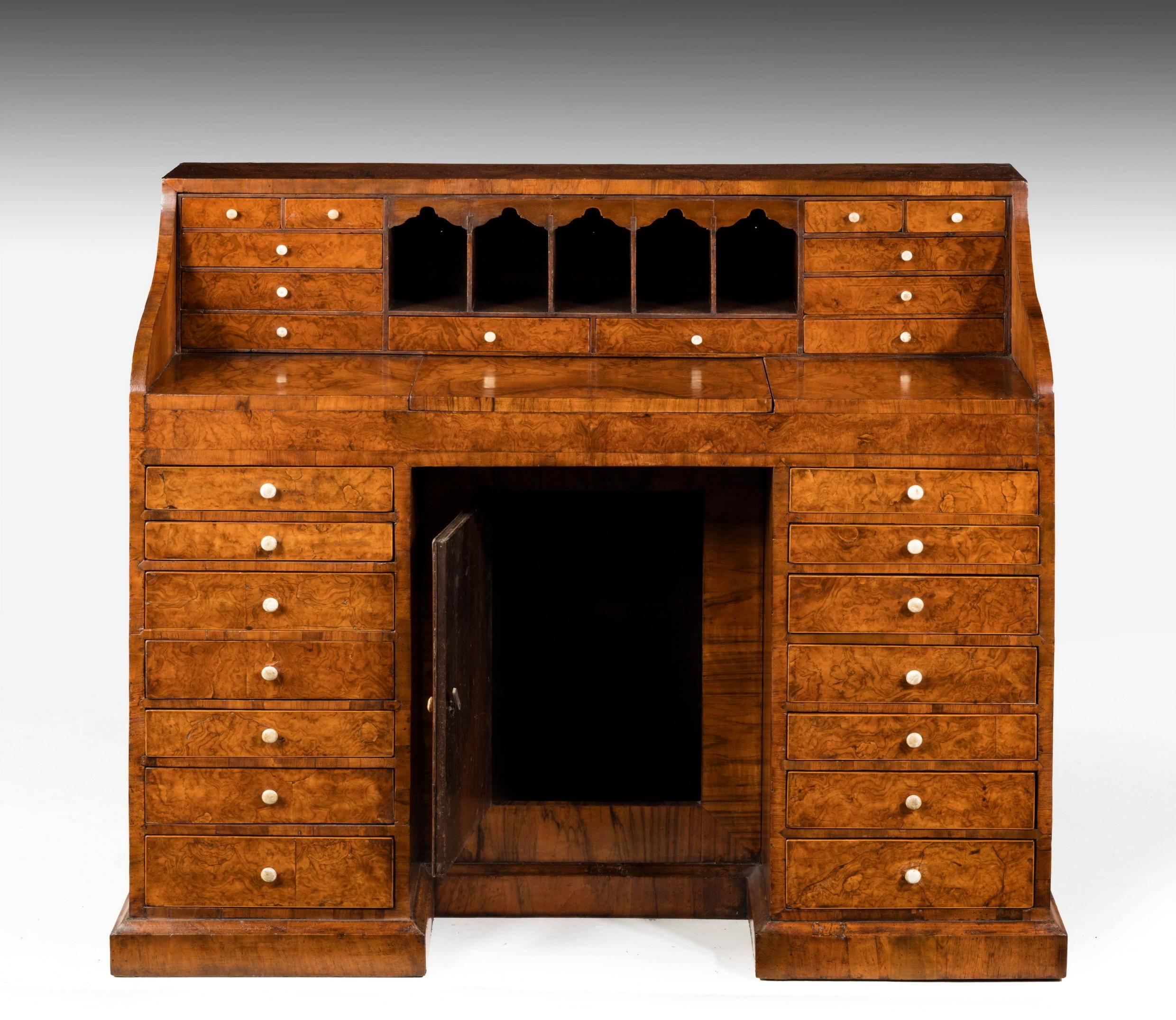 A most unusual shaped walnut desk of small proportions. Originally referred to in the family as the doctor’s desk. Particularly beautifully figured timbers. Multiple drawers. 