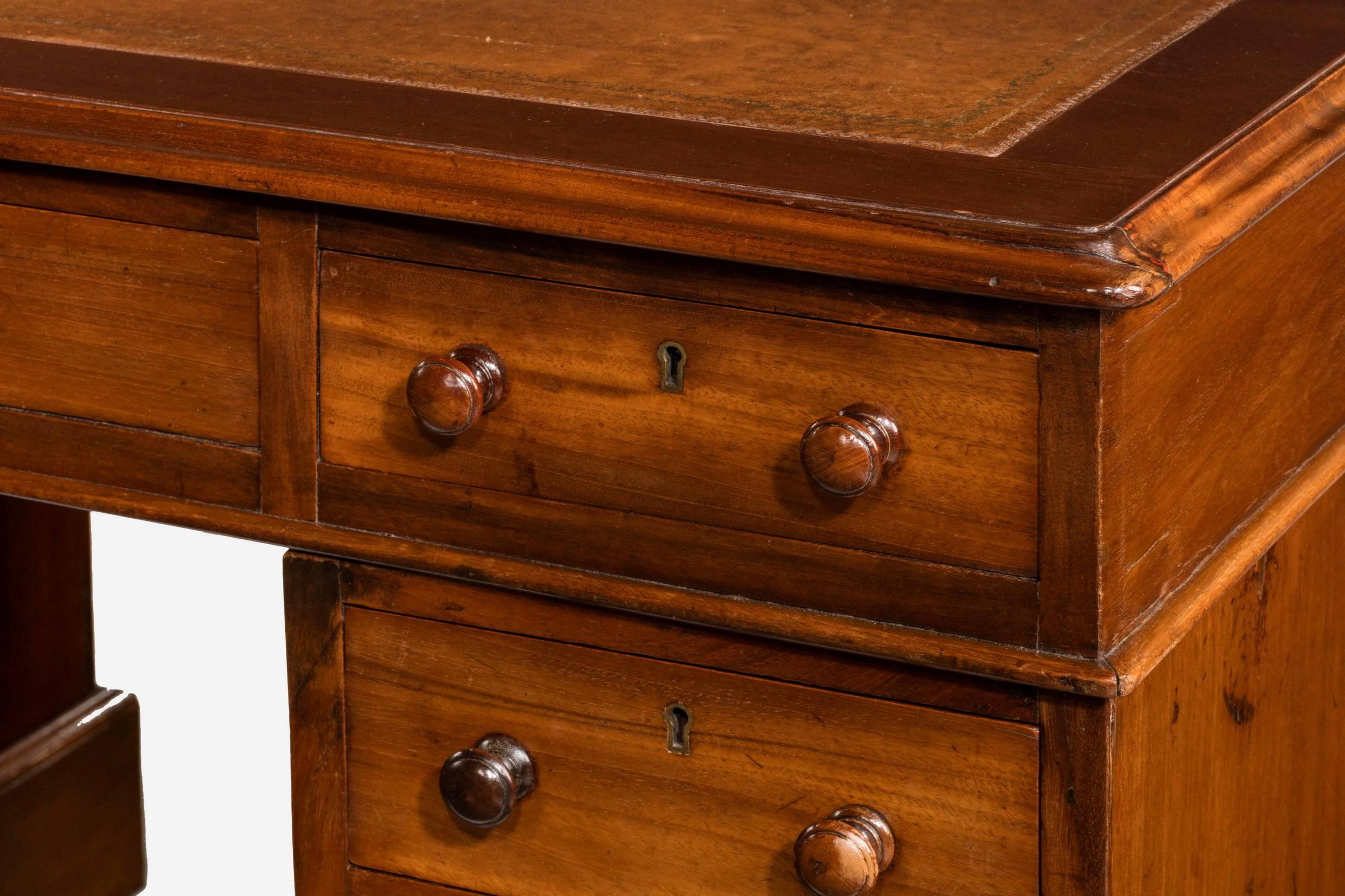 Three-part Victorian mahogany pedestal desk. With a brown tooled inset top which has been around for a number of years. Polished reverse for centre standing.