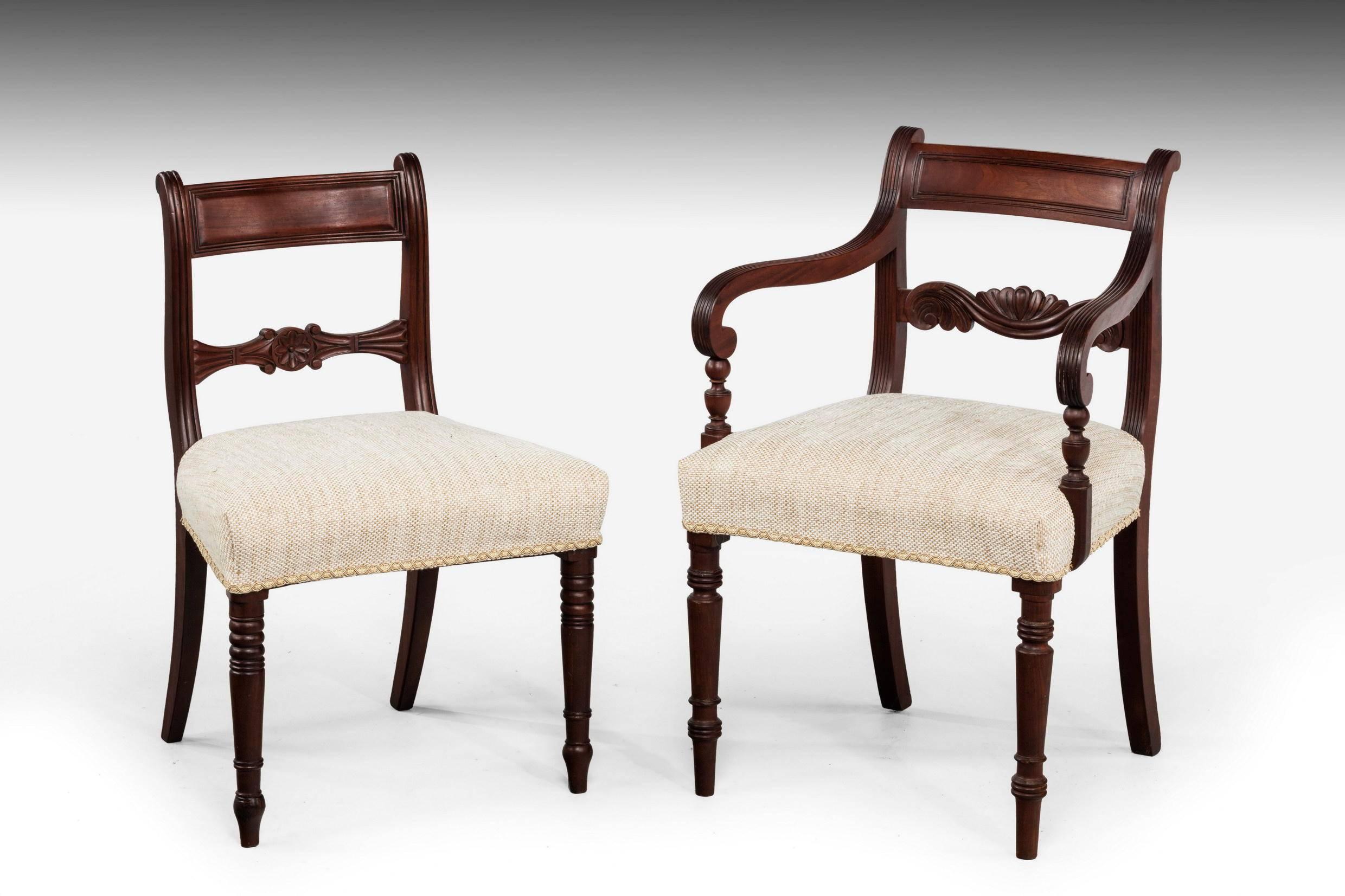 A good and original set of eight (six plus two) Regency period mahogany framed chairs. The arms continuously reeded. On tapering turned supports. The back central splat finely carved with scrolls.

Measures: Single chairs (inches):

height