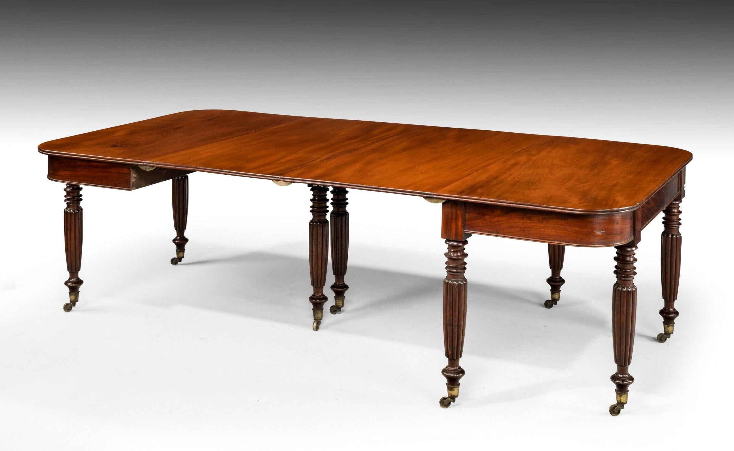 Most adaptable late Regency mahogany two-section dining table with three additional leaves. Capable of seating 4–12 persons.

D ends 1 leaf:
Width 68.50 inches.

D ends 2 leaves:
Width 90 inches.

D ends 3 leaves:
Width 111.50 inches.