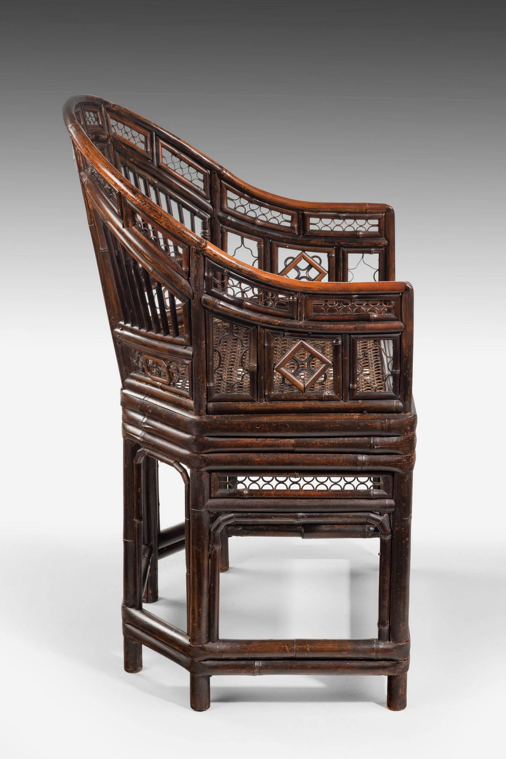 A most attractive Regency period pavilion cane armchair, with elaborate work all in excellent condition. Retaining the original cane work seat.