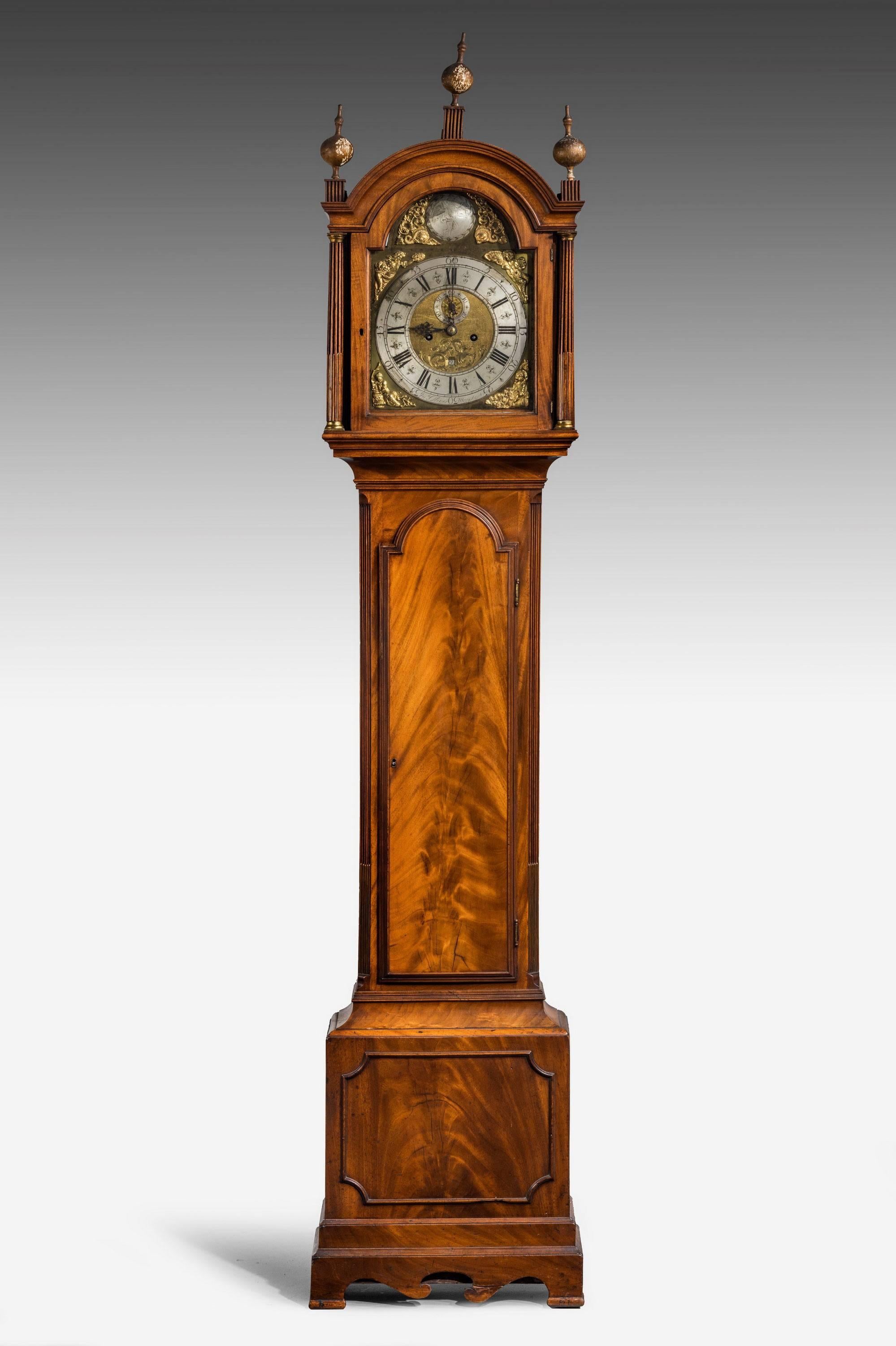 A fine George III period mahogany longcase clock by John Oliver of Manchester. The silver and gilt bronze dial in original condition with an arched top finely engraved with farther time. Period finals to the top section. The arched door finely