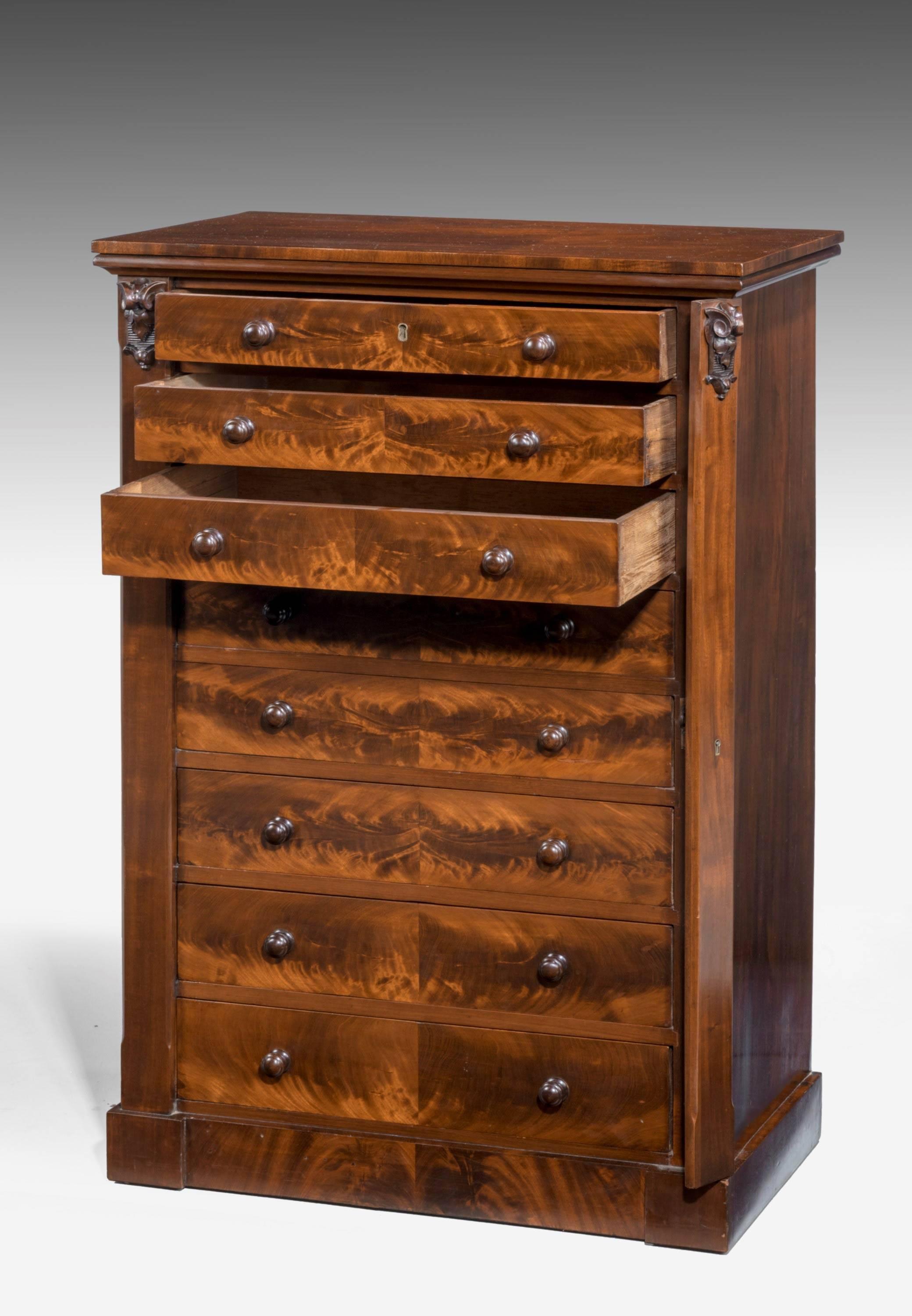 A particularly fine quality unusually wide 19th century Wellington chest. Carved sections the top of the uprights. In wonderful original condition with beautifully figured timbers. Oak linings to the drawers.