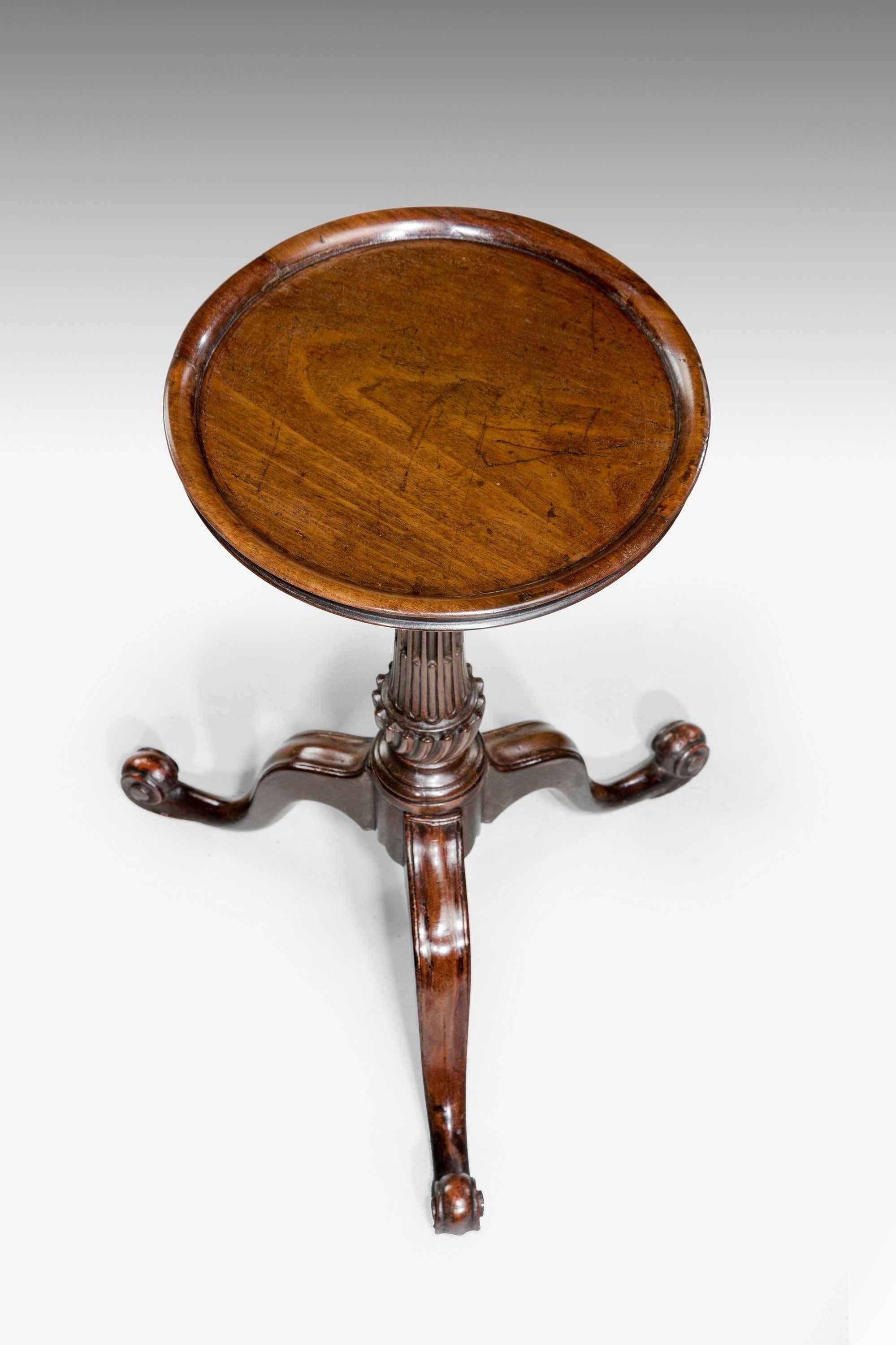 Chippendale period mahogany Kettle stand, the dished top over a well reeded and writhen stem, the cabriole supports well shaped terminating in a French scroll foot.
