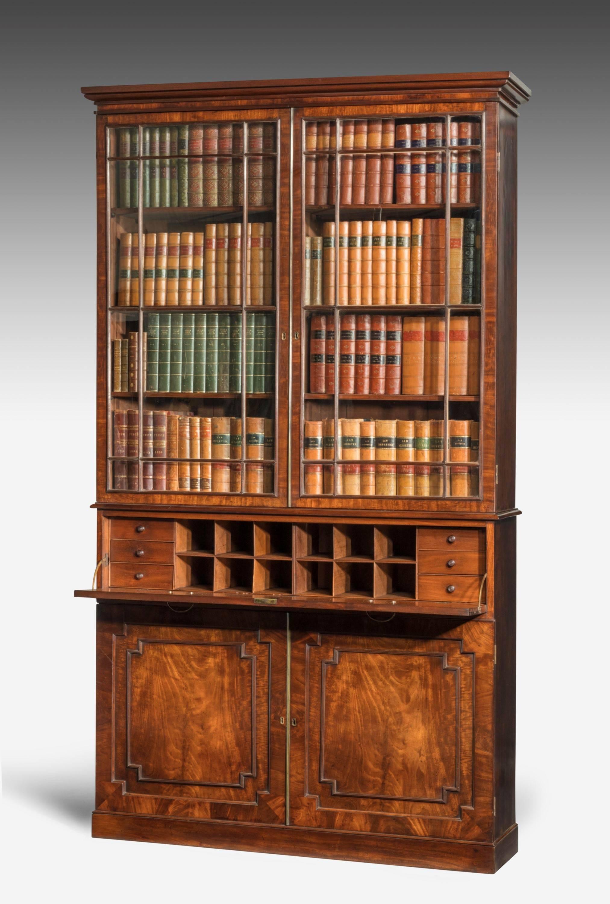 A good George III period estate secretaire bookcase in mahogany. The beautifully figured base drawers under a fitted forefront section. Good original glazing and of unusually slender proportions.