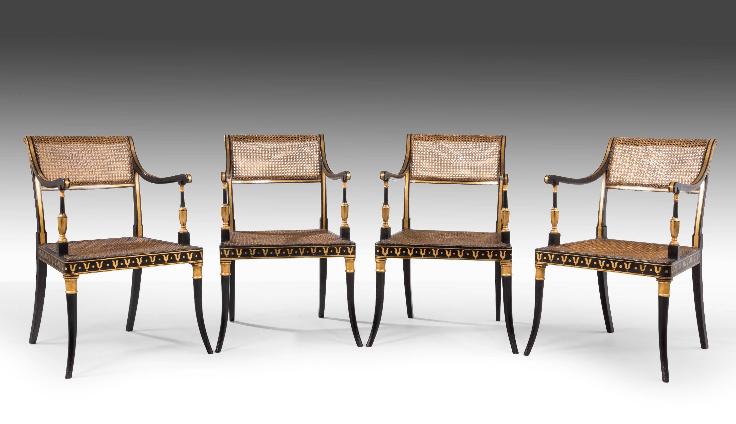 English Set of Four Regency Period Lacquered and Parcel Gilt Elbow Chairs