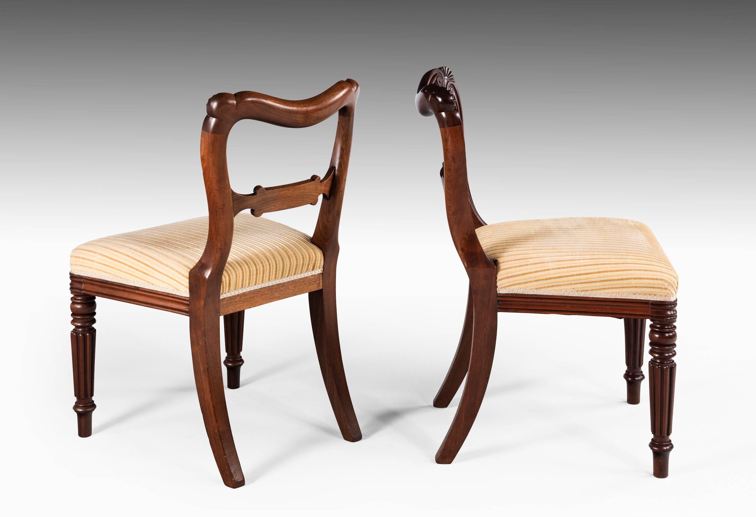 A fine set of 12 late Regency period mahogany chairs. Almost certainly by Gillows of Lancaster. Crisply carved decoration on finely turned reeded supports. Eight of the chairs circa 1825 and four of a later date.