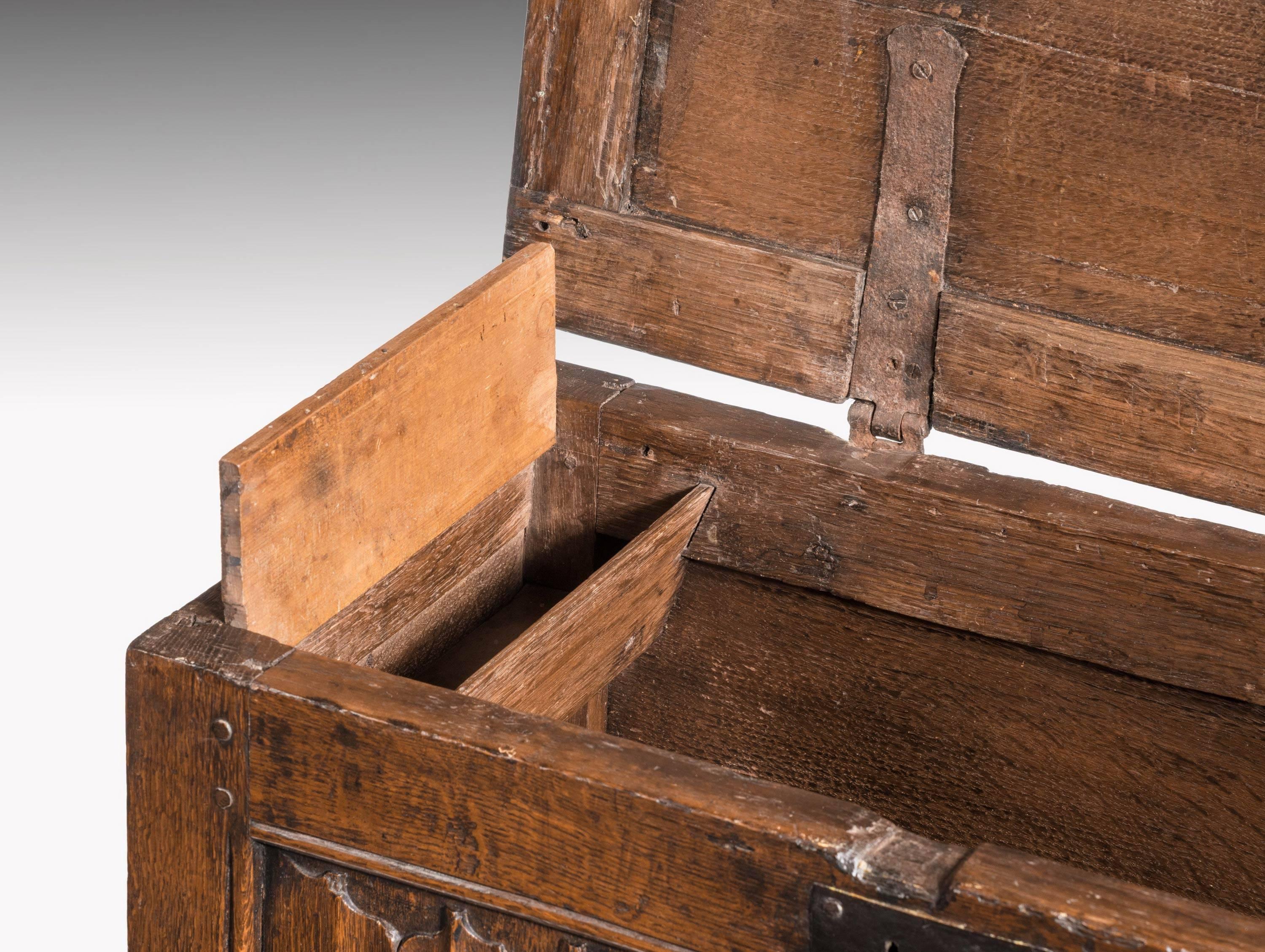A rare late 17th century oak kist. The interior containing a candle section. With fine linen fold panelling and of very small and unusual size. 

N

A Kist (also called Coffer or Chest) is one of the oldest forms of furniture. It is typically a