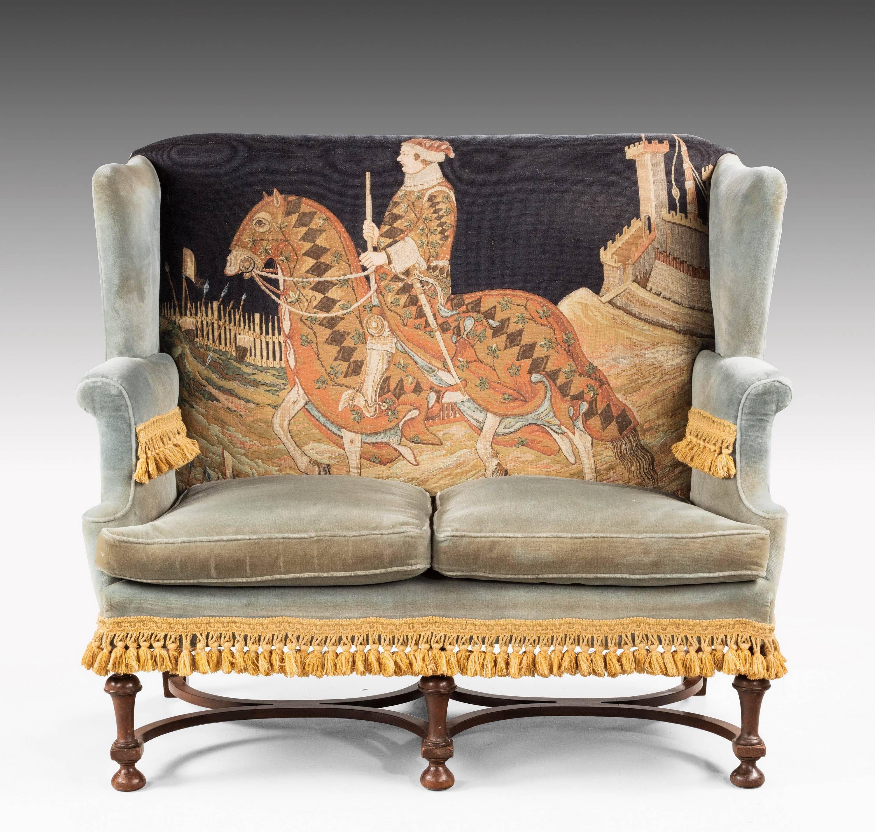 A most unusual William and Mary walnut style sofa. The back with a very large hand drawn and executed worked tapestry of an equestrian figure. Fine quality frame, retaining the original shaped stretchers.

Seat height 19 inches.

N
 