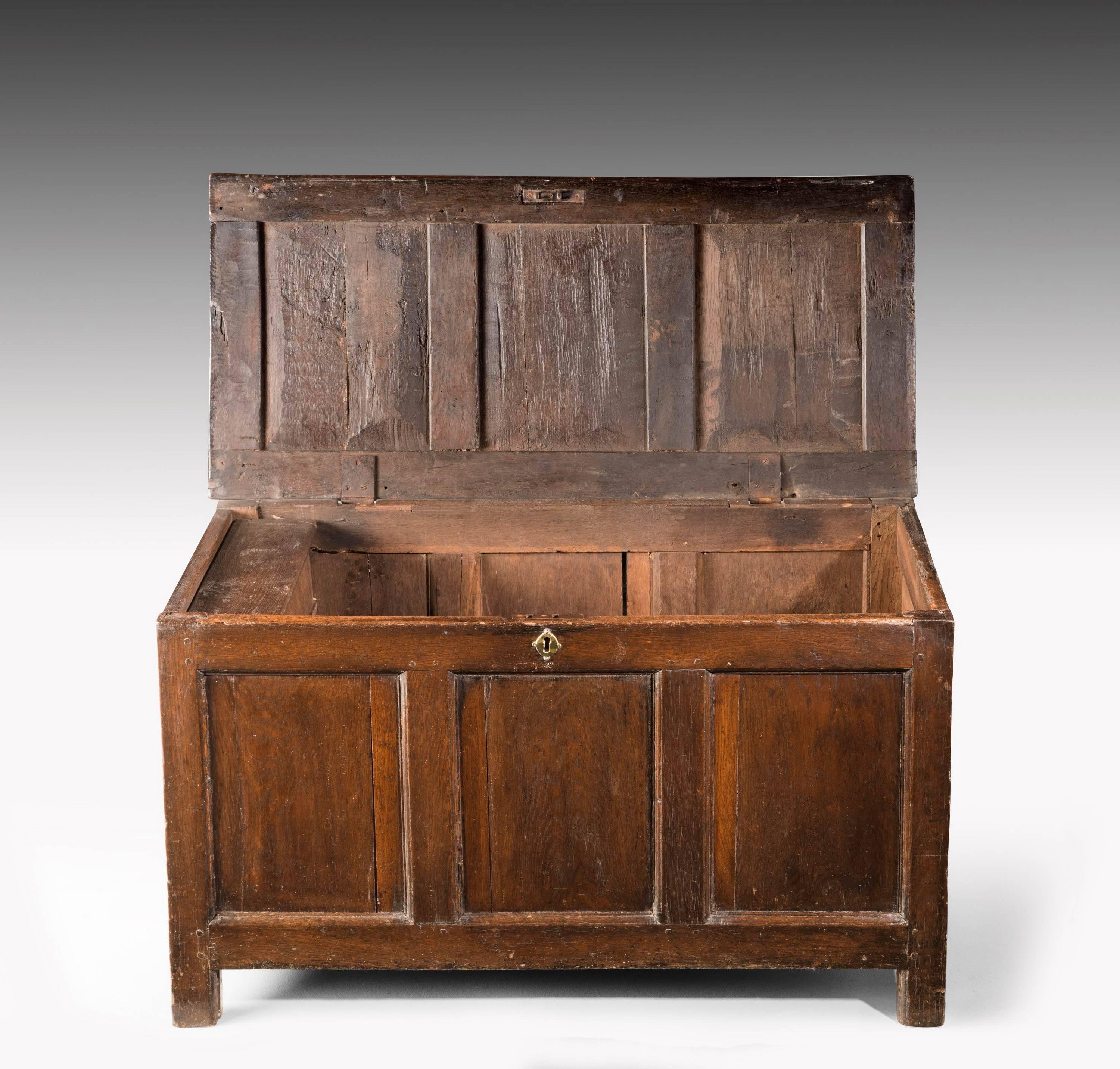 A good early 18th century oak panelled coffer/kist . The top compartment opening to reveal a candle box. Excellent overall patina and colour

N

A Kist ( also called Coffer or Chest ) is one of the oldest forms of furniture. It is typically a