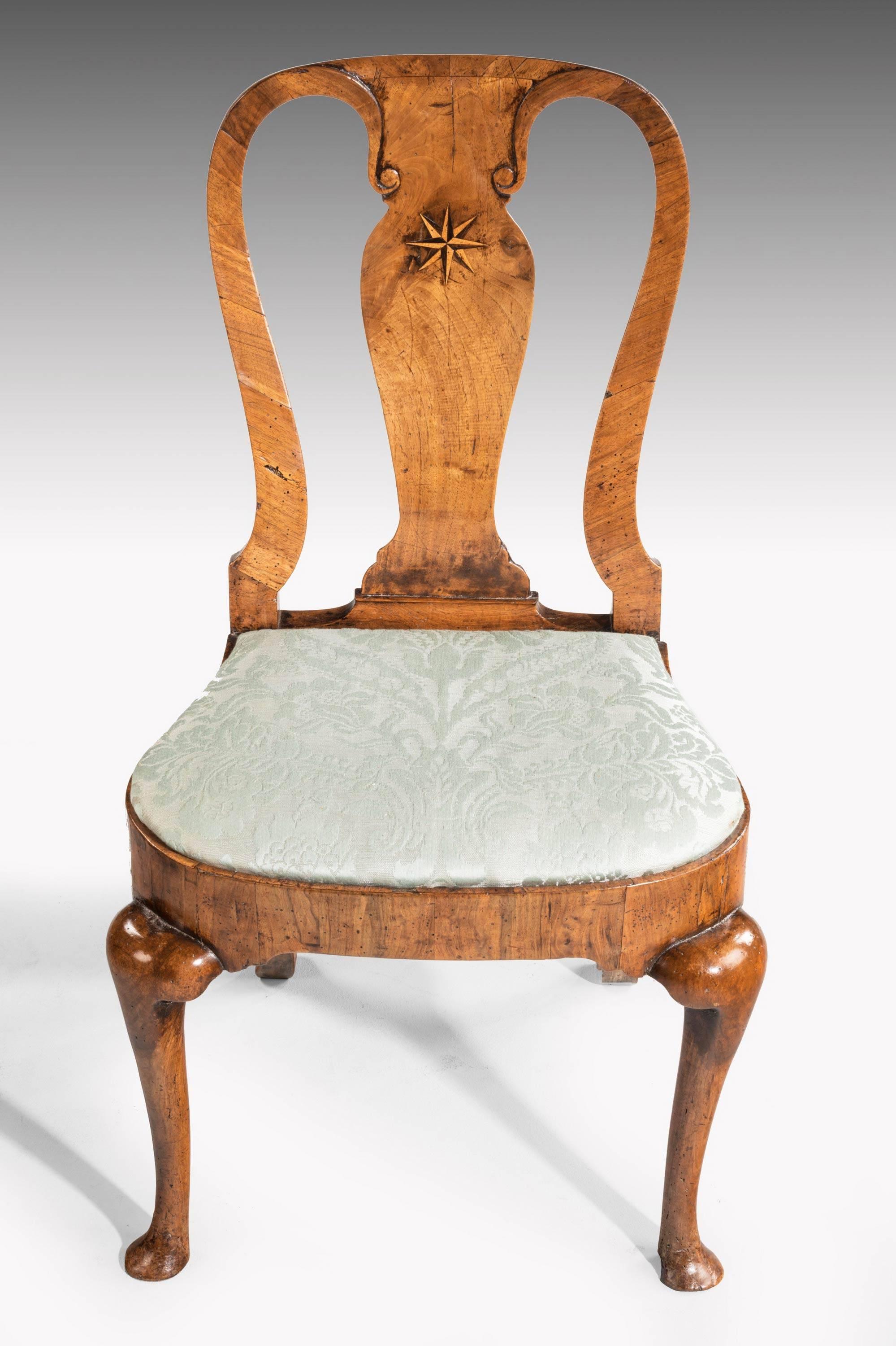 An attractive Queen Anne period walnut single chair. The vase shaped back with boxwood and ebony star inlay. Fine cabriole supports, overall a lovely honey color.

Measures: Seat height 18 inches.

                  