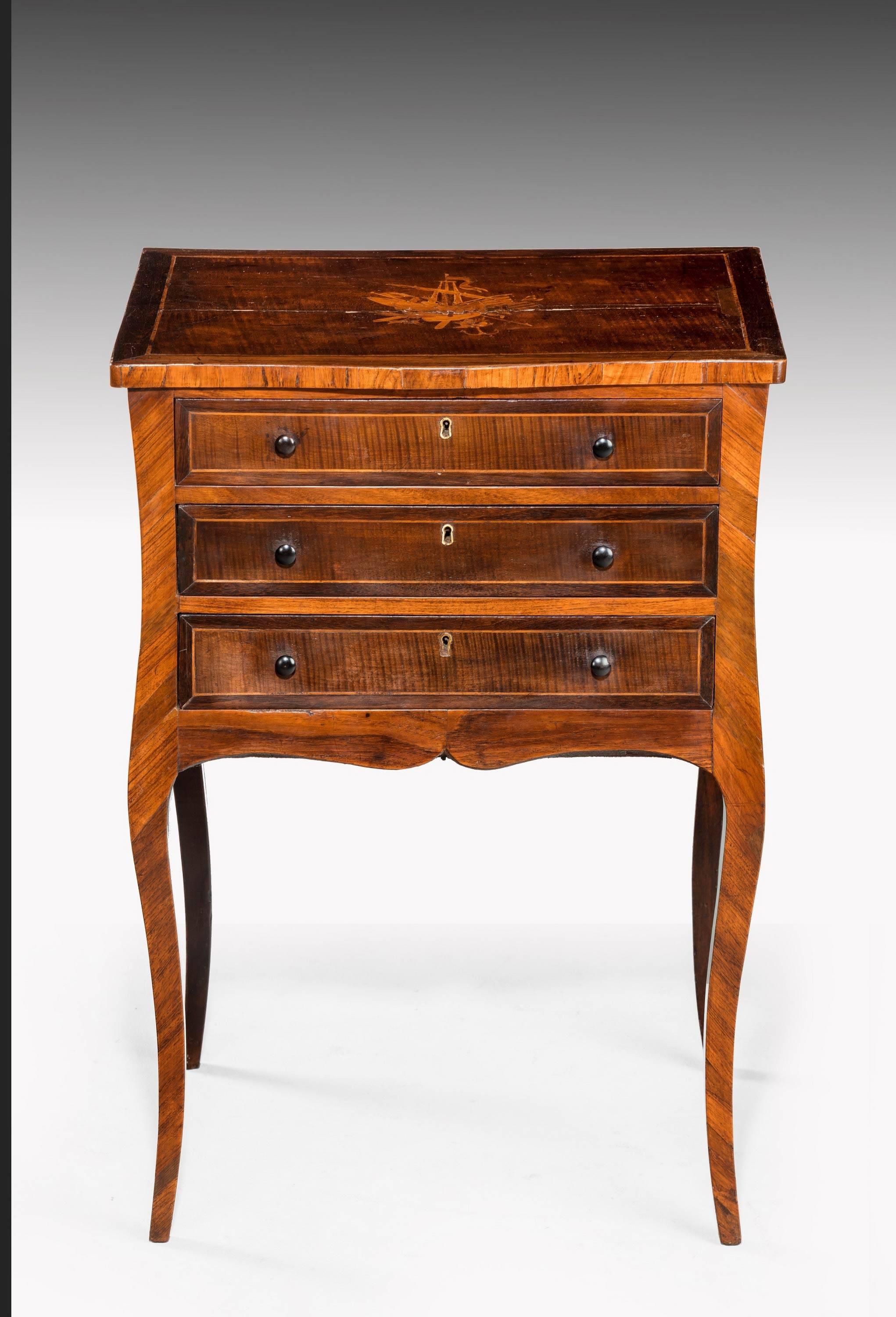 A rare partridge wood petit commode on shaped square section cabriole supports. The whole finely veneered with contrasting sections. The top with a marquetry panel within a border.

 