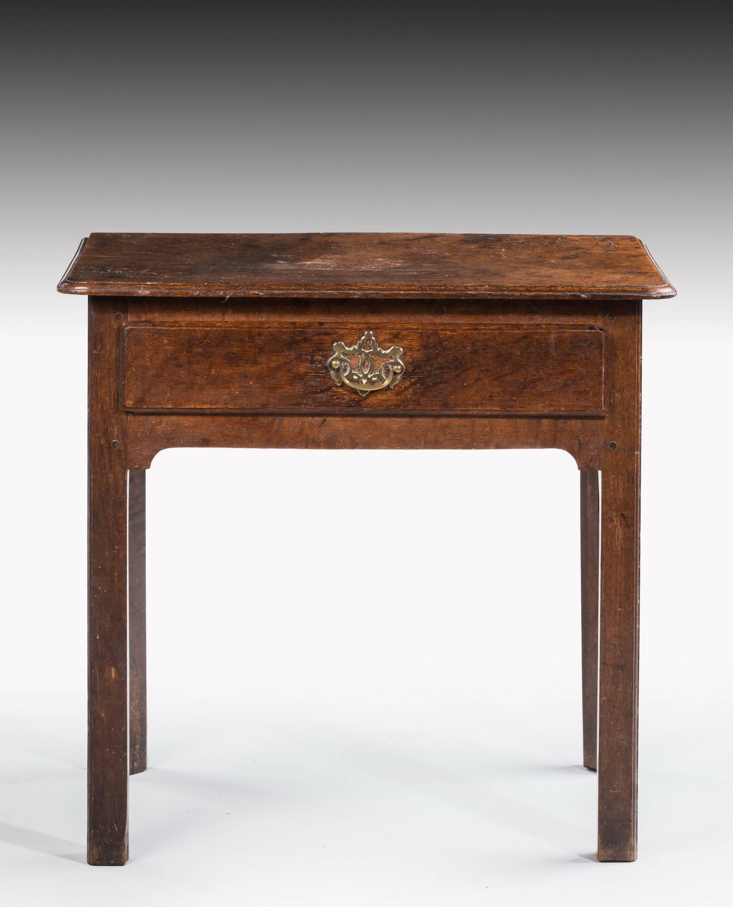 A particularly good and original mid-18th century single drawer side table. On square shaped supports. The whole with fine original patina and color. 

