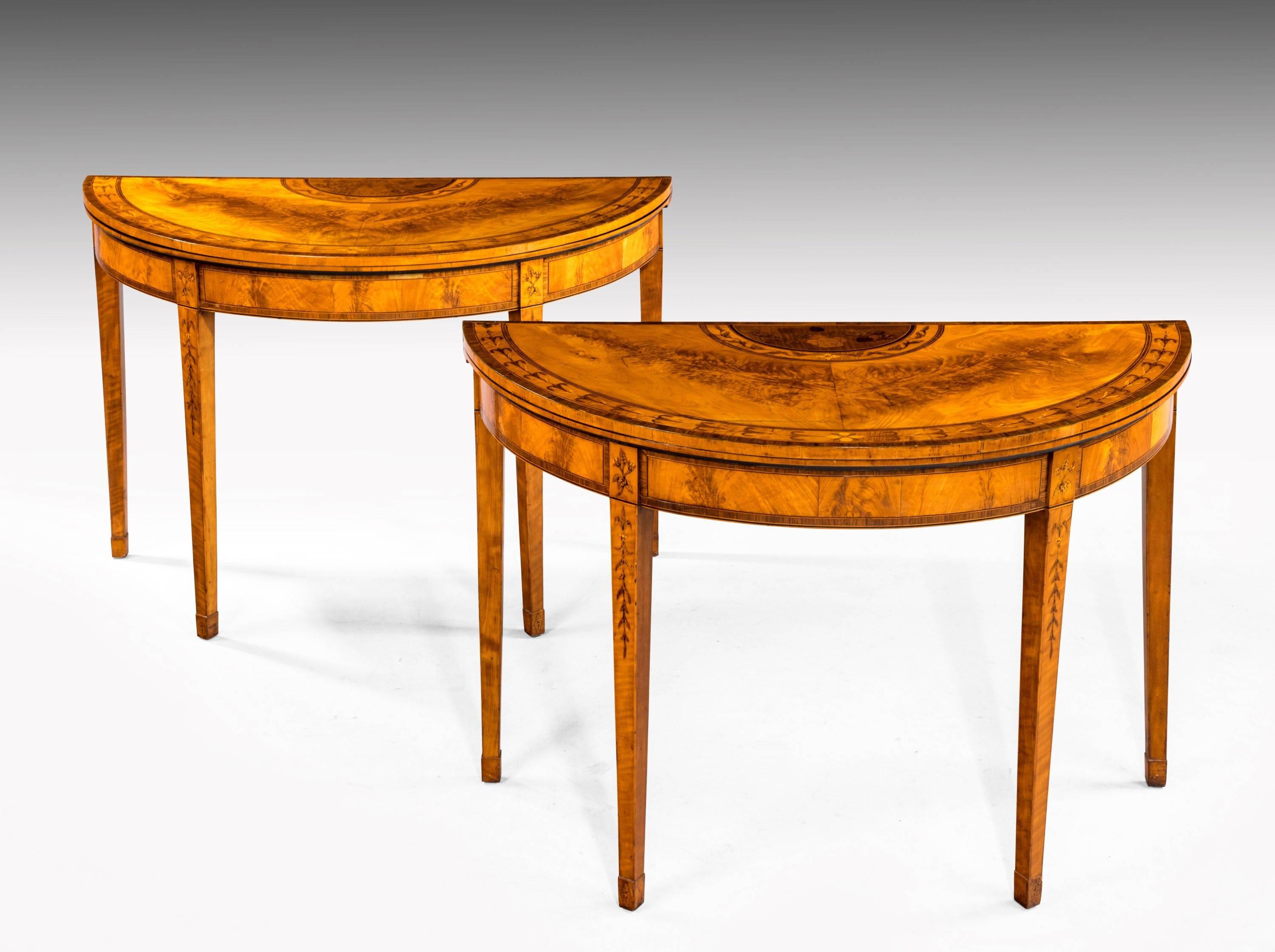 A quite exceptional pair of George III period satinwood card tables. With marquetry and parquetry inlay showing the finest detail. Very much in the style of Mahew Ince . On tapering supports, with hair bell and leaf decoration. Overall of top London