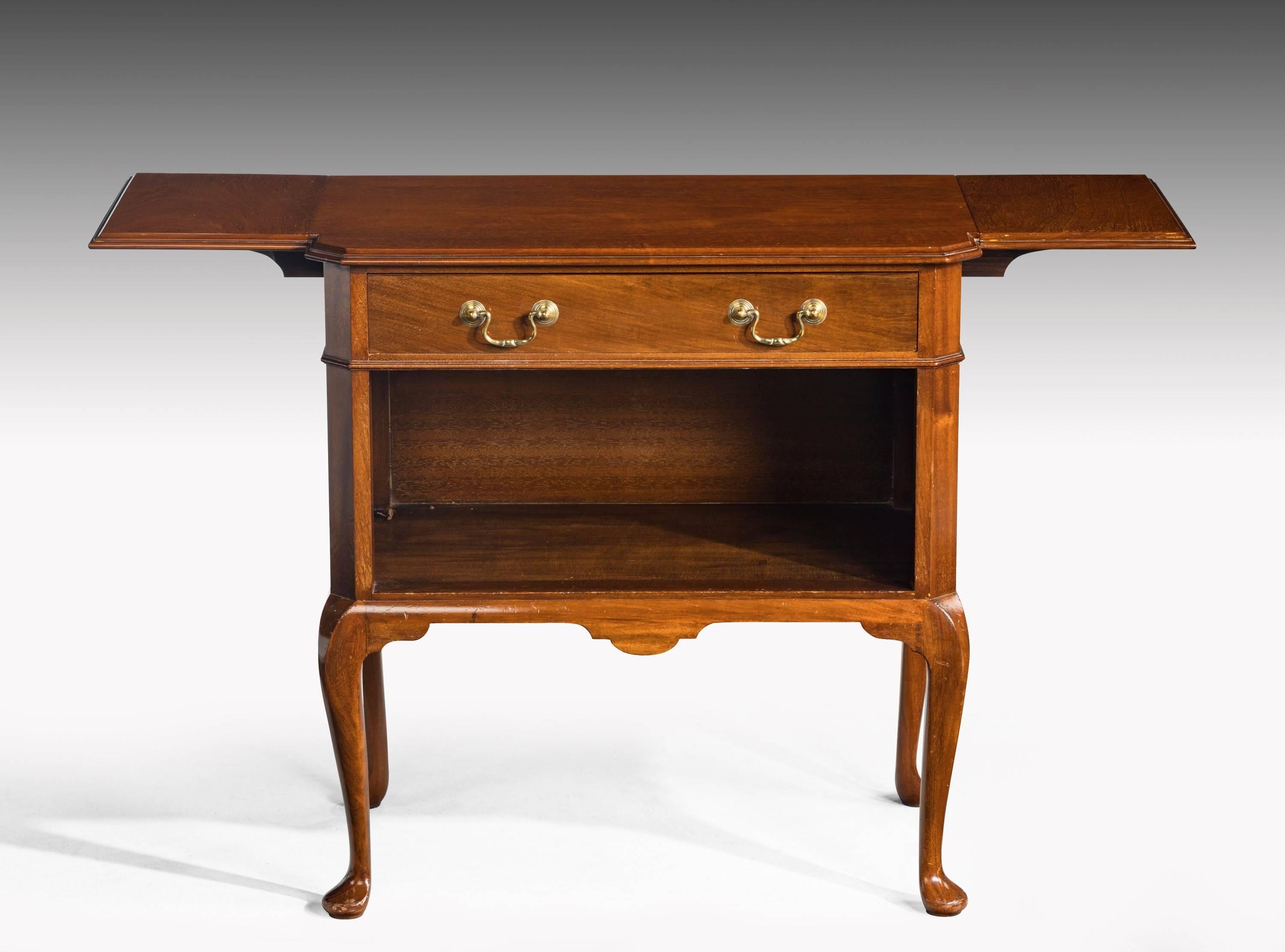 A very well made late 20th century mahogany night table incorporating an open book space and a drawer to the top section. With two lifting flaps to either side. Short cabriole supports

 