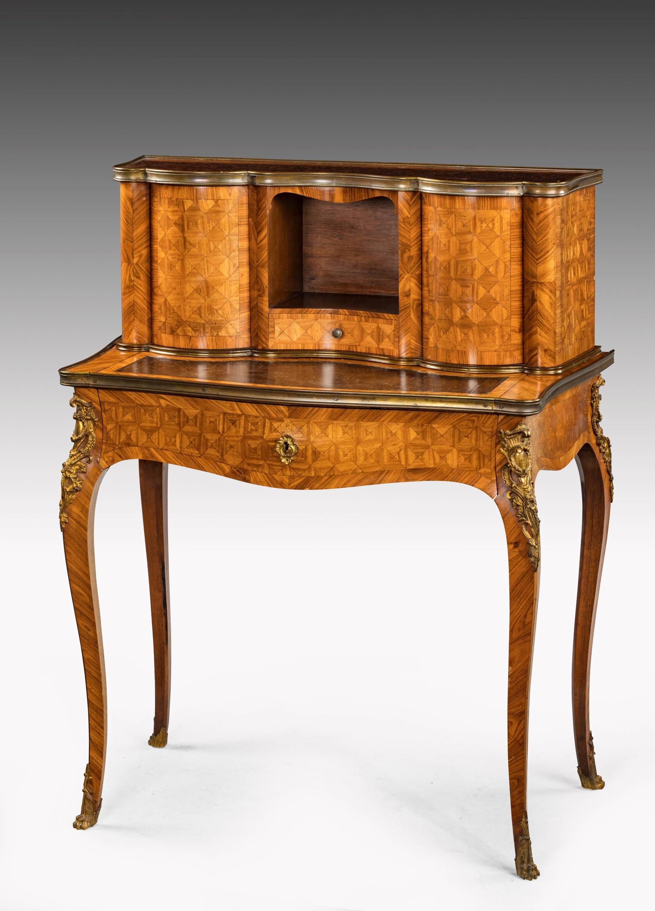 A very well made parquetry Kingwood Bonheur du jour with metaphoric action to the two bowed top sections. Very finely engineered, retaining original surface to the top section. 

 