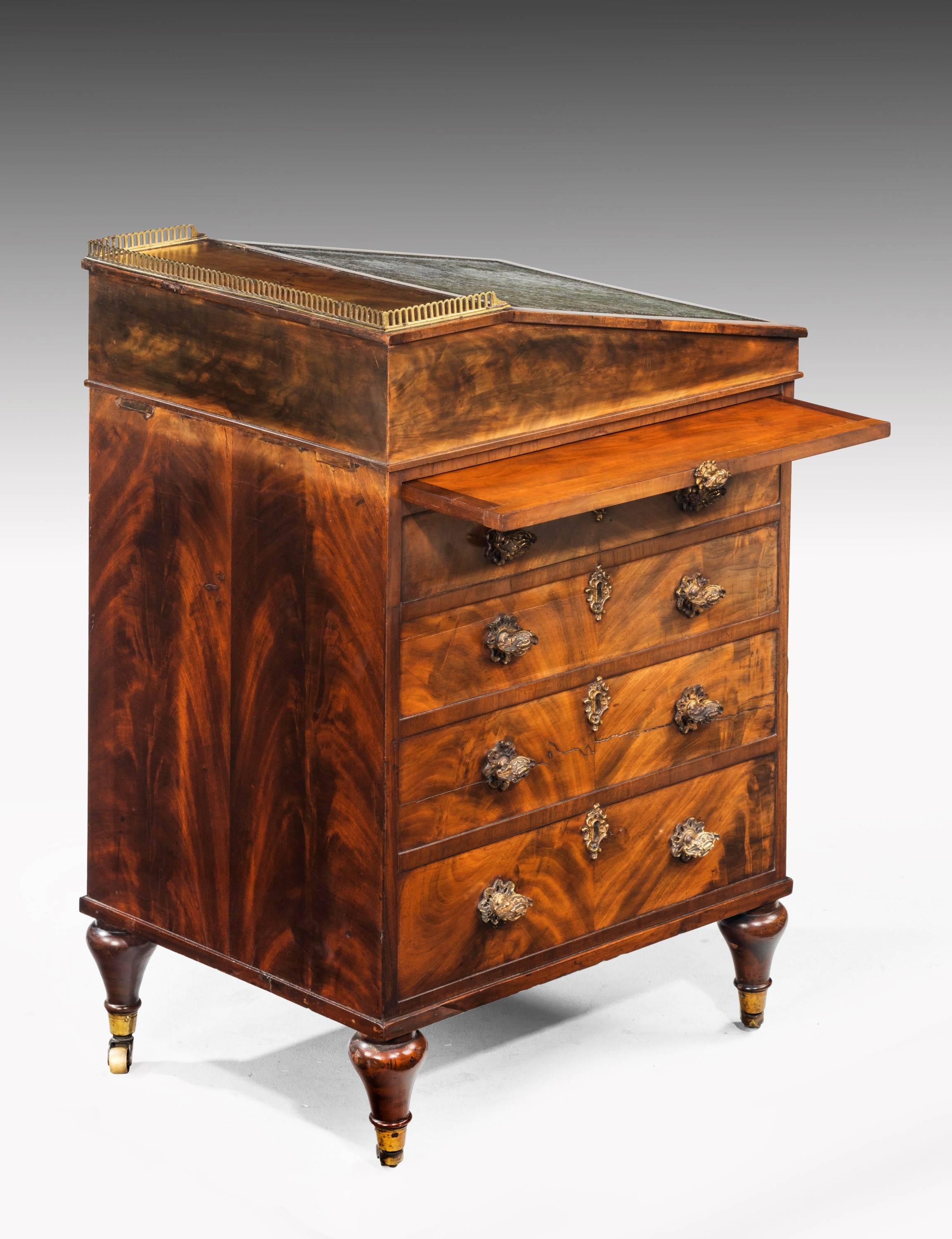 A Regency period mahogany Davenport desk of quite exceptional quality and with beautifully figured timbers. Retaining original calfskin writing surface to the top which is now somewhat worn. Extraordinary fine gilt bronze escutcheons and