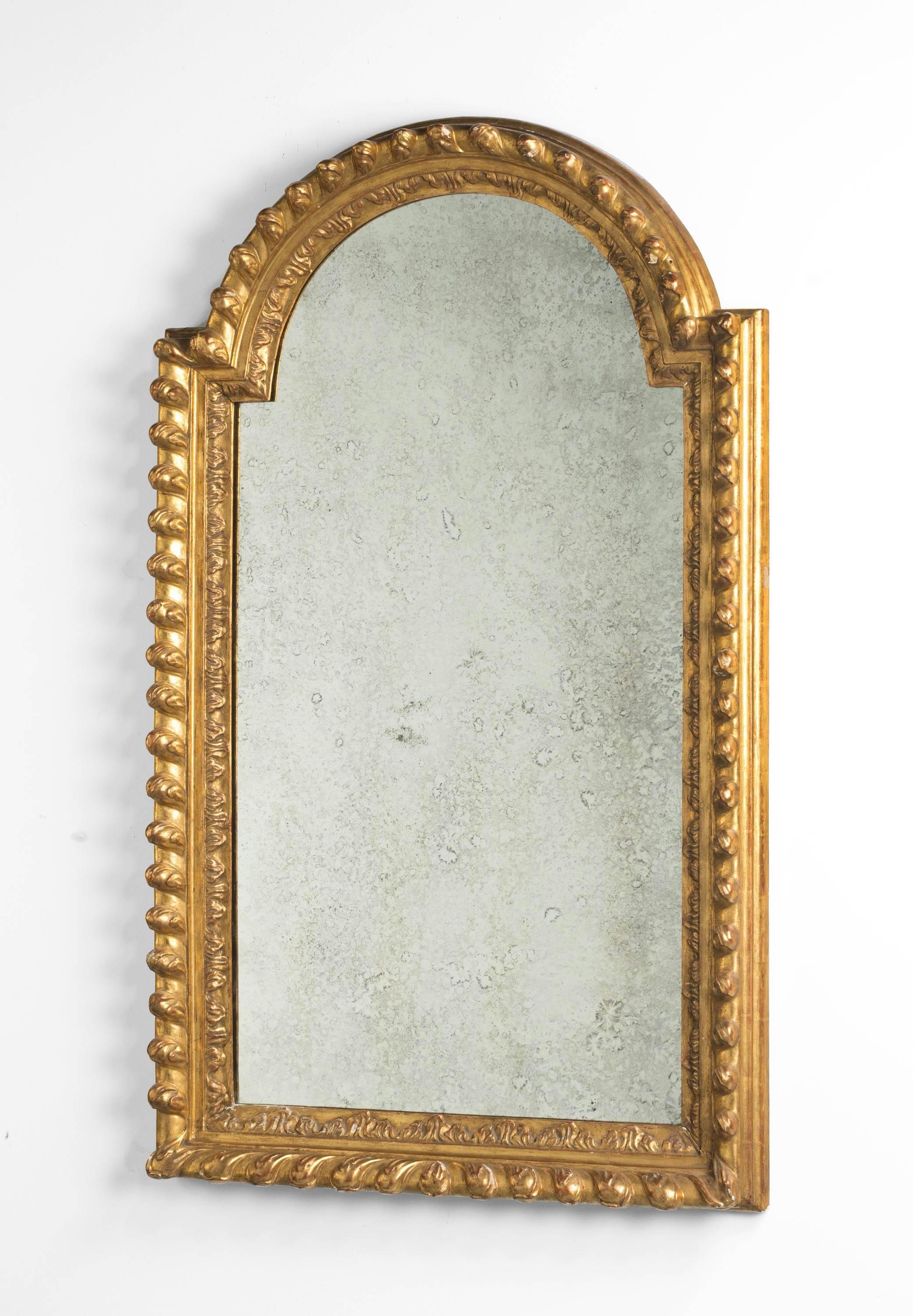 An attractive pair of mid-19th century giltwood and gesso mirrors. Largely with original gilding which is oil based. Well carved edges in excellent overall condition. Showing slight oxidation but in keeping with the period. 

N.