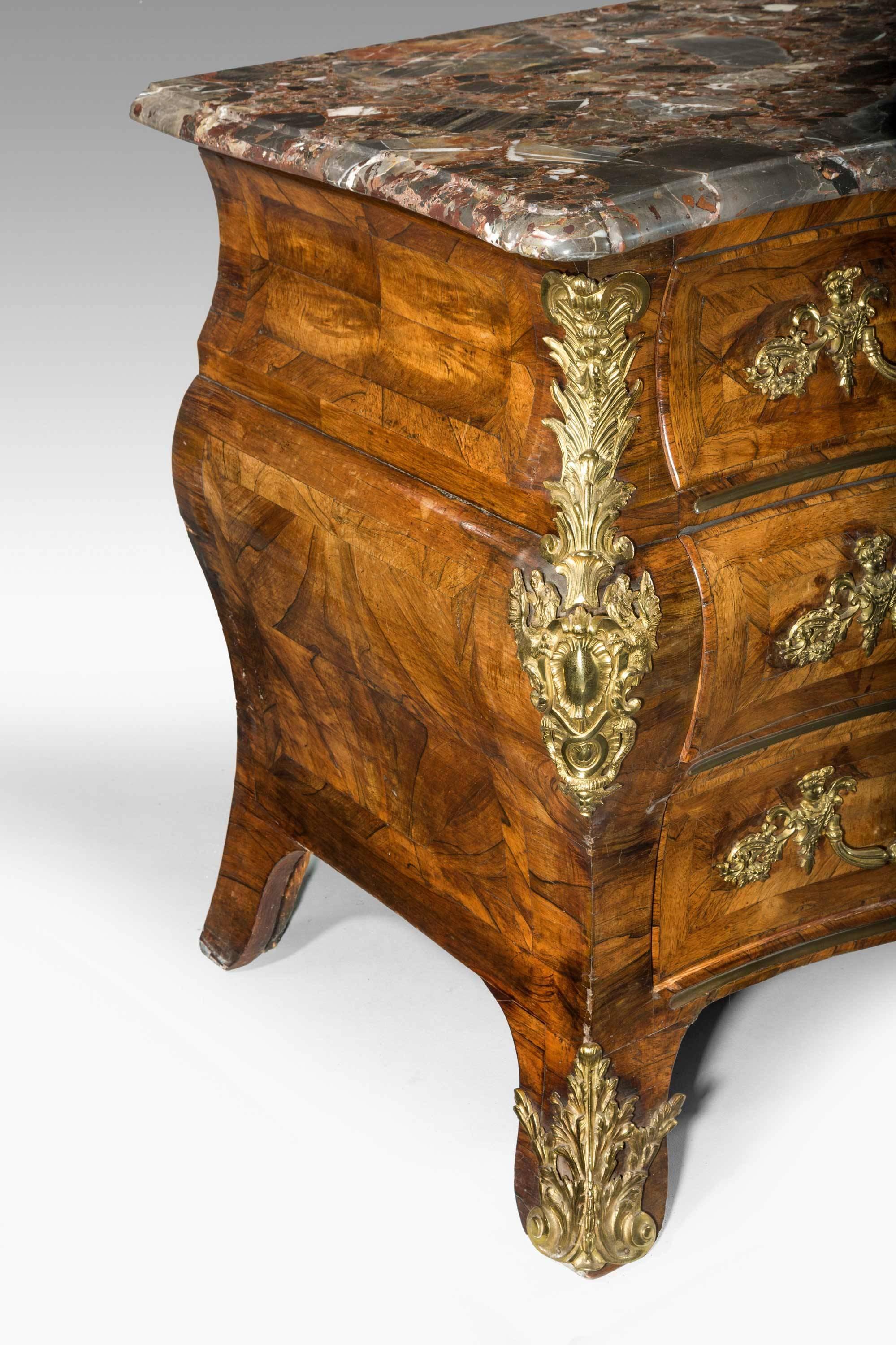 An exceptionally fine Louis XV bombe kingwood commode retaining original period gilt bronze mounts and with a Breche-Violette marble. Formerly in the collection of Dame Barbara Cartland, grandmother of HRH The Princess Diana. Sold in a 1970s estate