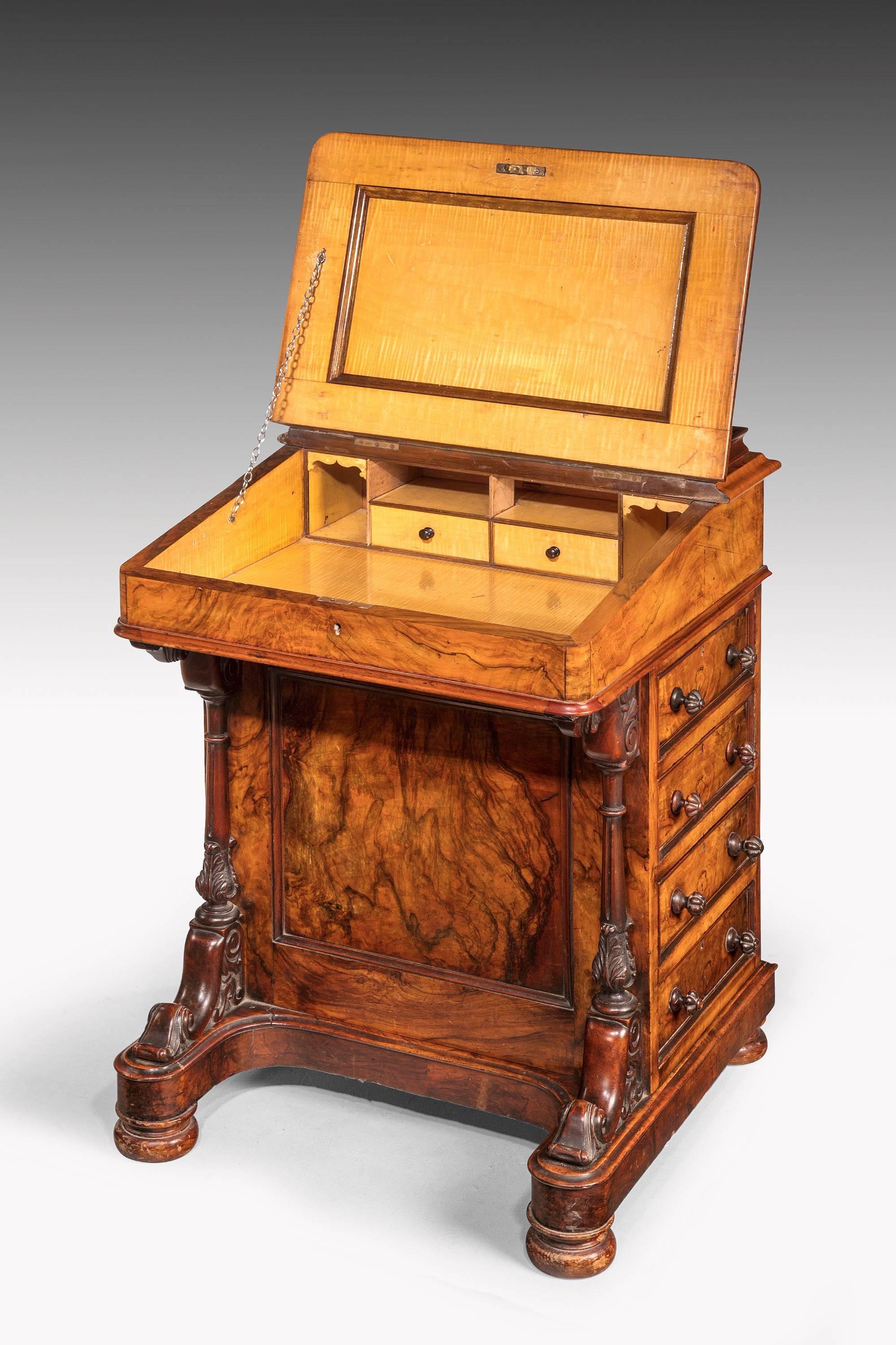 A very good quality and beautifully figured mid-19th century walnut Davenport desk. The interior of satin timber incorporating drawers and Pidgeon holes.