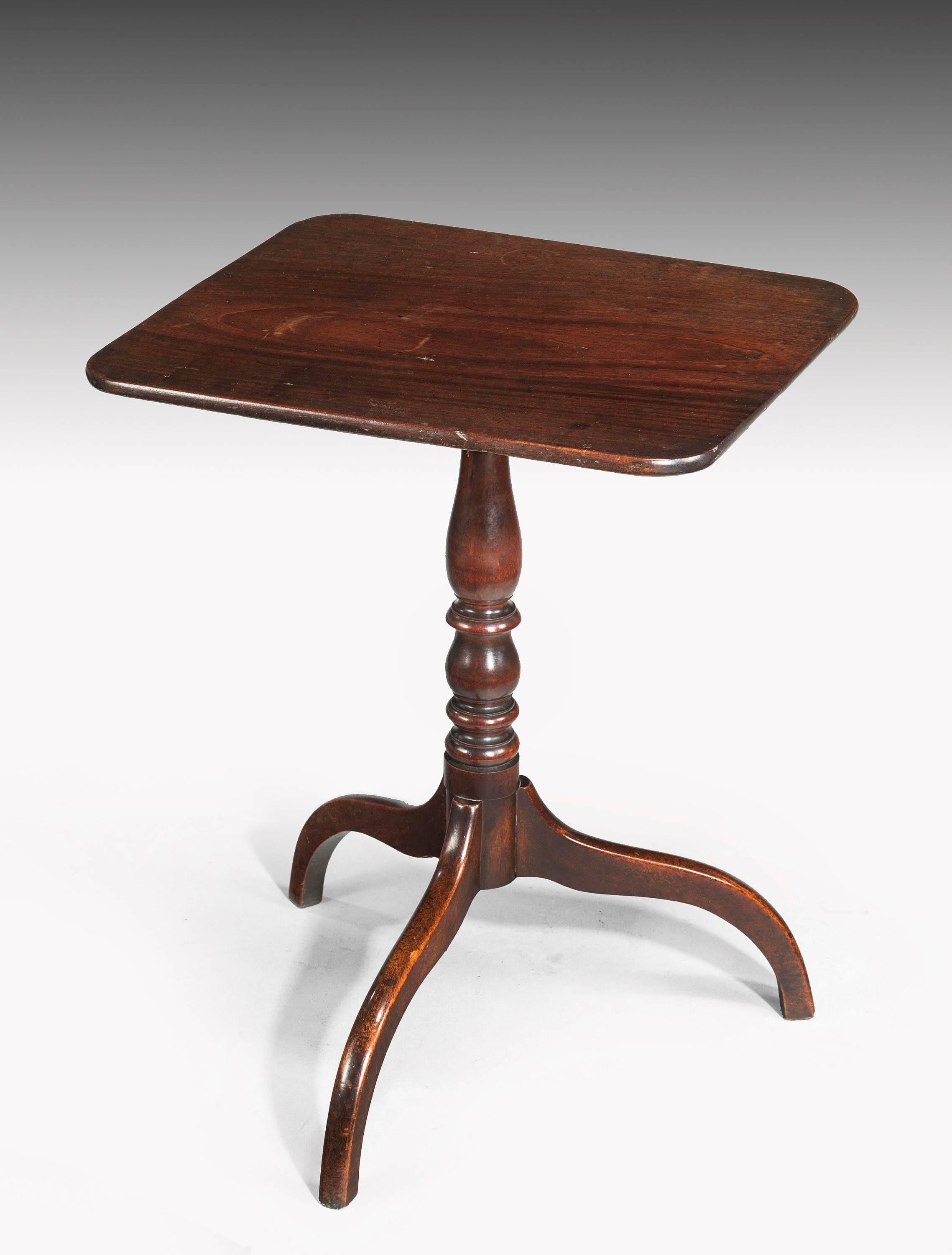 George III period mahogany tilt table on a well turned centre support over three umbrella legs. Well patinated with original surfaces.