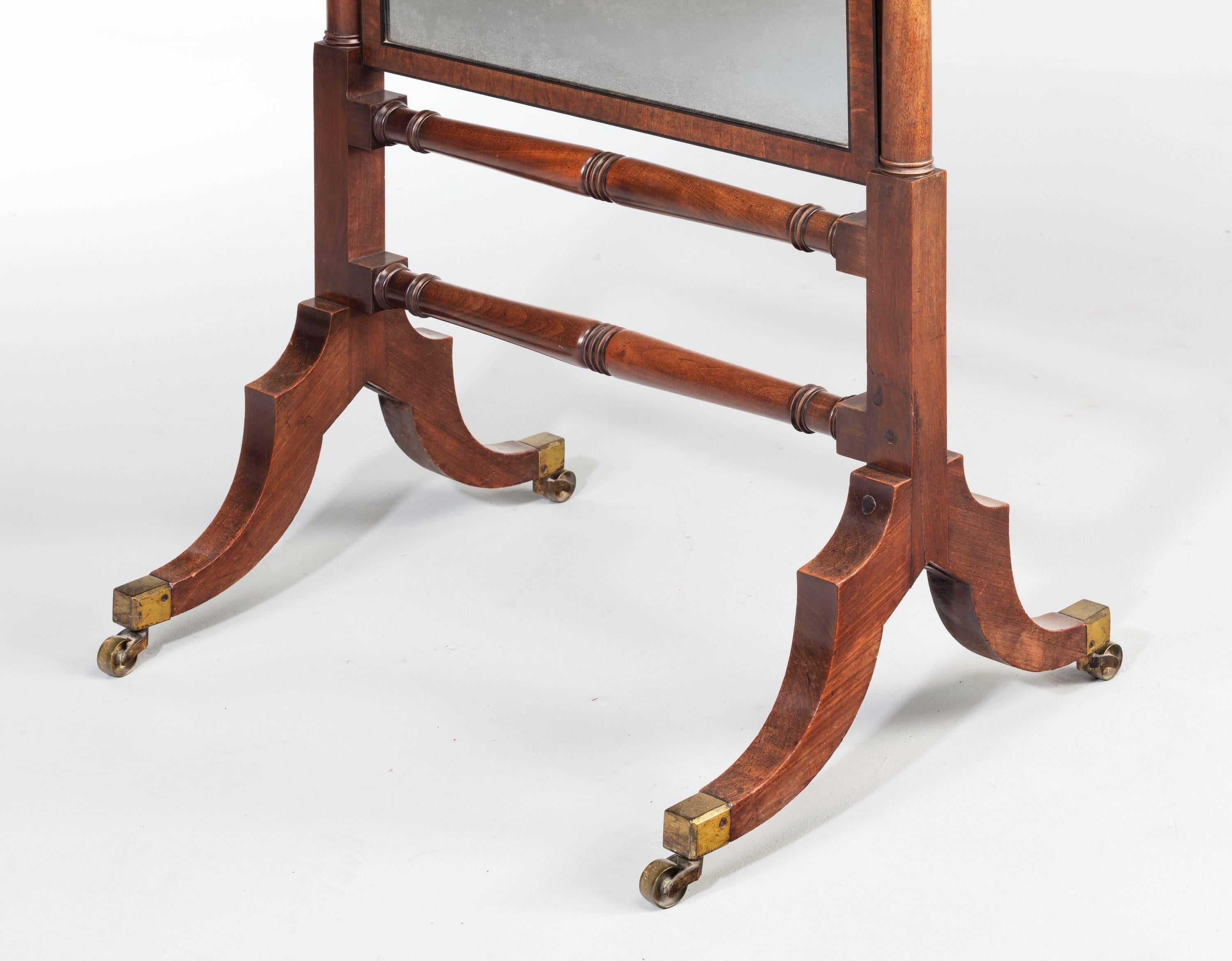 A George III period mahogany cheval mirror on finely turned supports. Excellent overall condition.