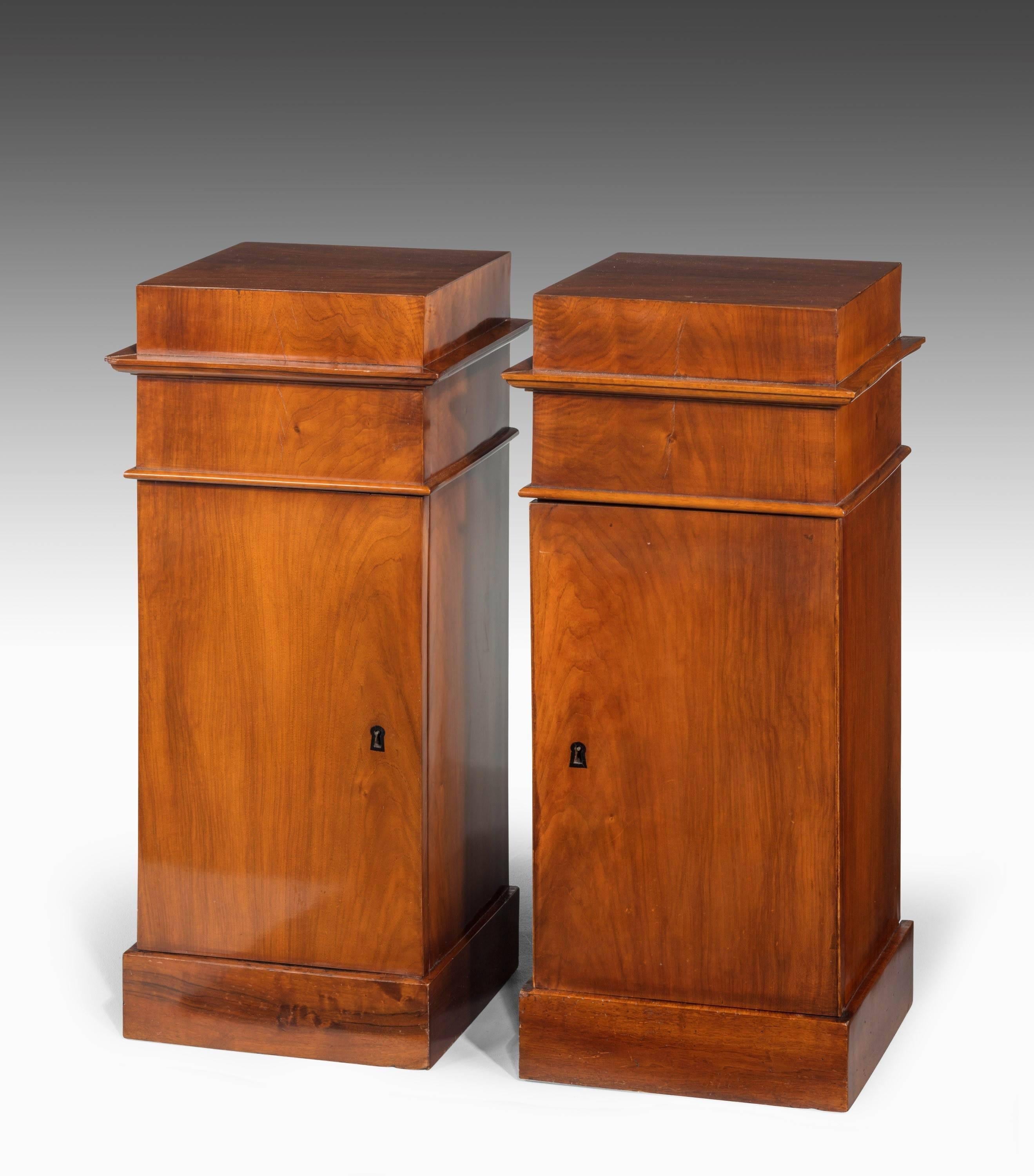 A very good pair of early 20th century mahogany pot cupboards of pillar form. Finely figured timber.