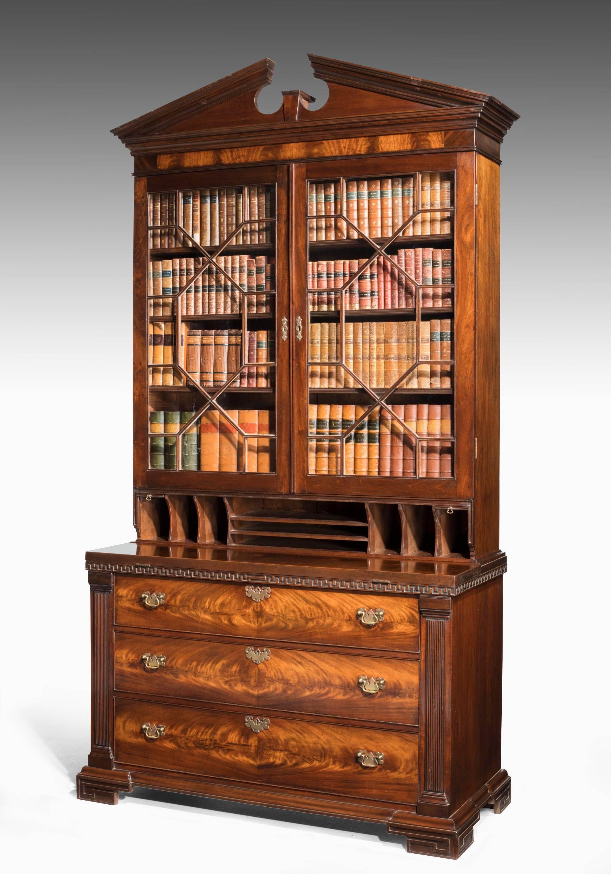 A very good quality Chippendale period mahogany secretaire bookcase. The top with astragal glazing over a very well fitted interior and original pediment. The base left and right hand doors with matching timbers. The centre section with pigeon holes.