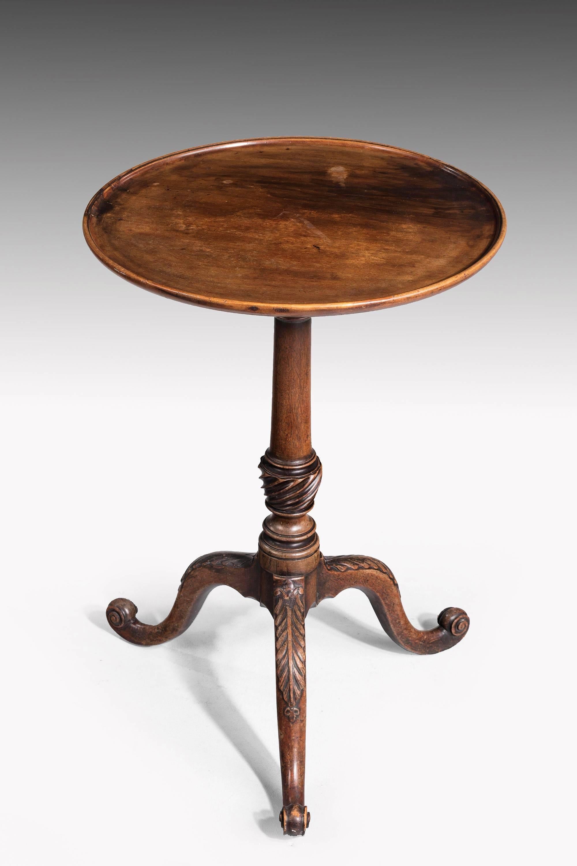George III period mahogany dish top tripod table with well carved Stand, on scrolled toes. Wonderful color.