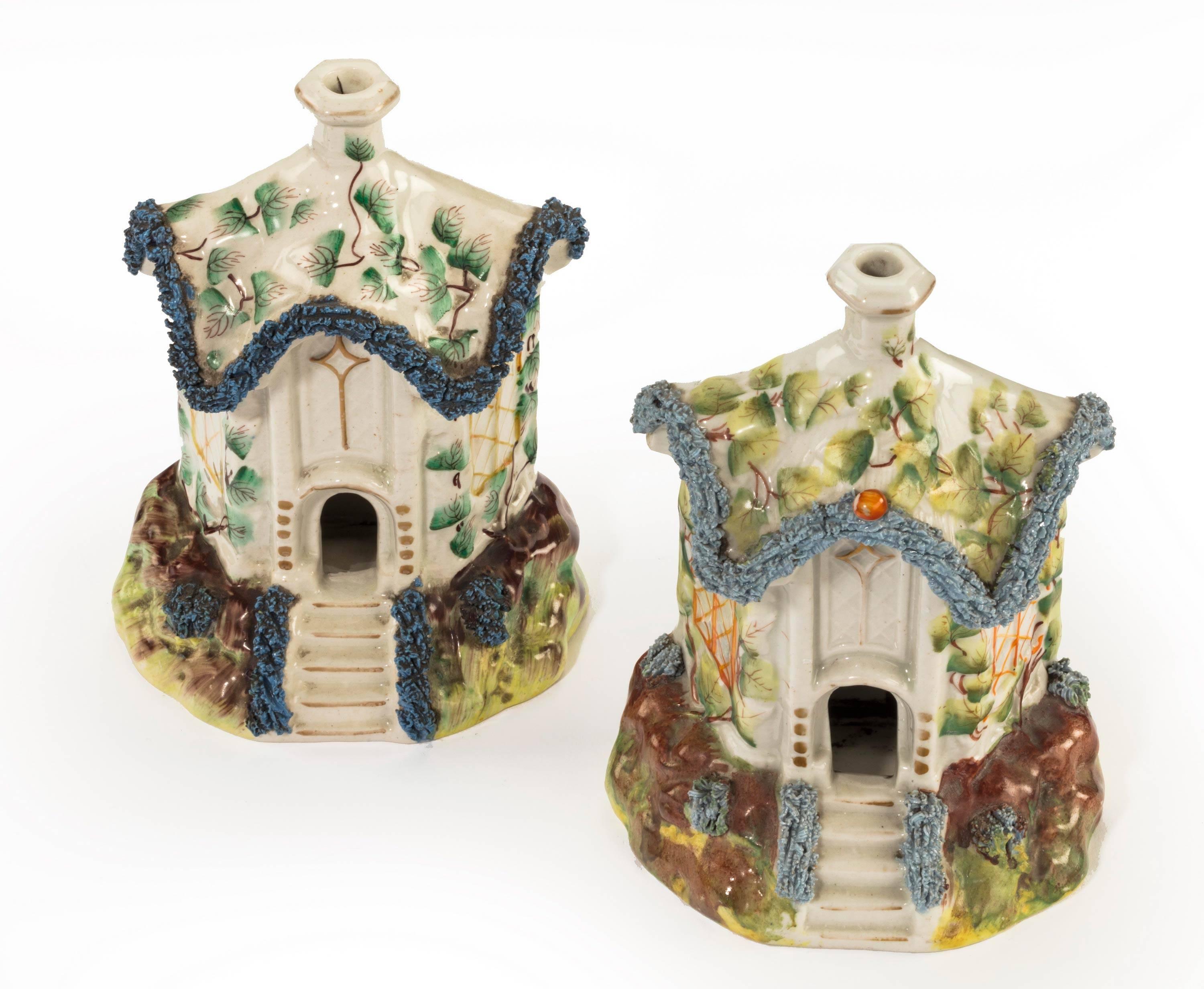 A most unusual pair of Staffordshire pottery pastille burner in the form of houses. With bocarge to the roof edgings. Excellent overall condition. Minor variation in the decorations.

The smaller:

Height 6 inches
Width 4 inches
Depth 2.75