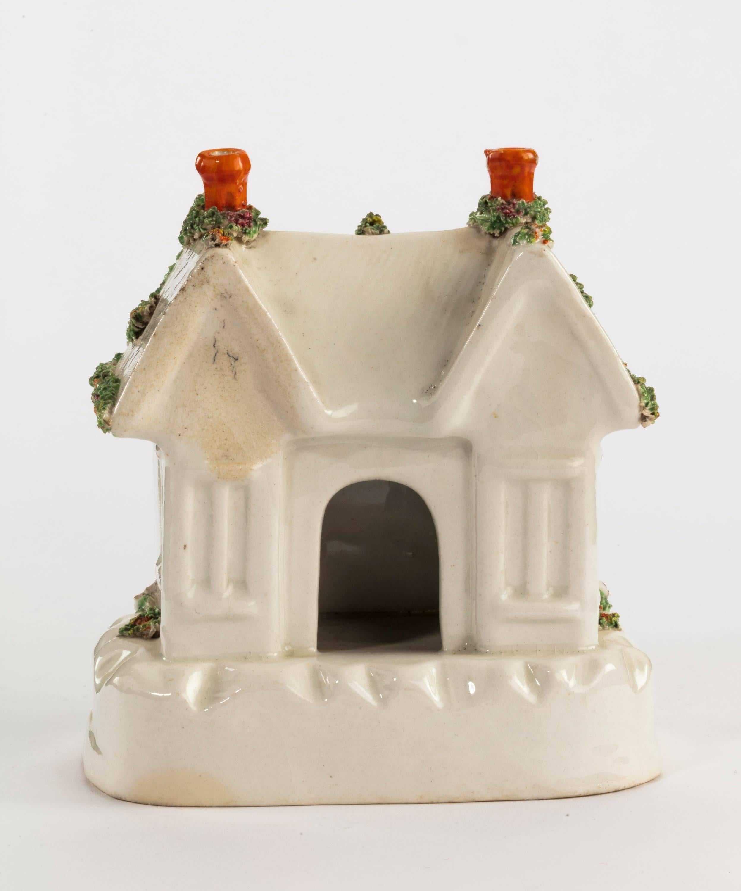 Staffordshire pottery pastille burner in the form of a house.