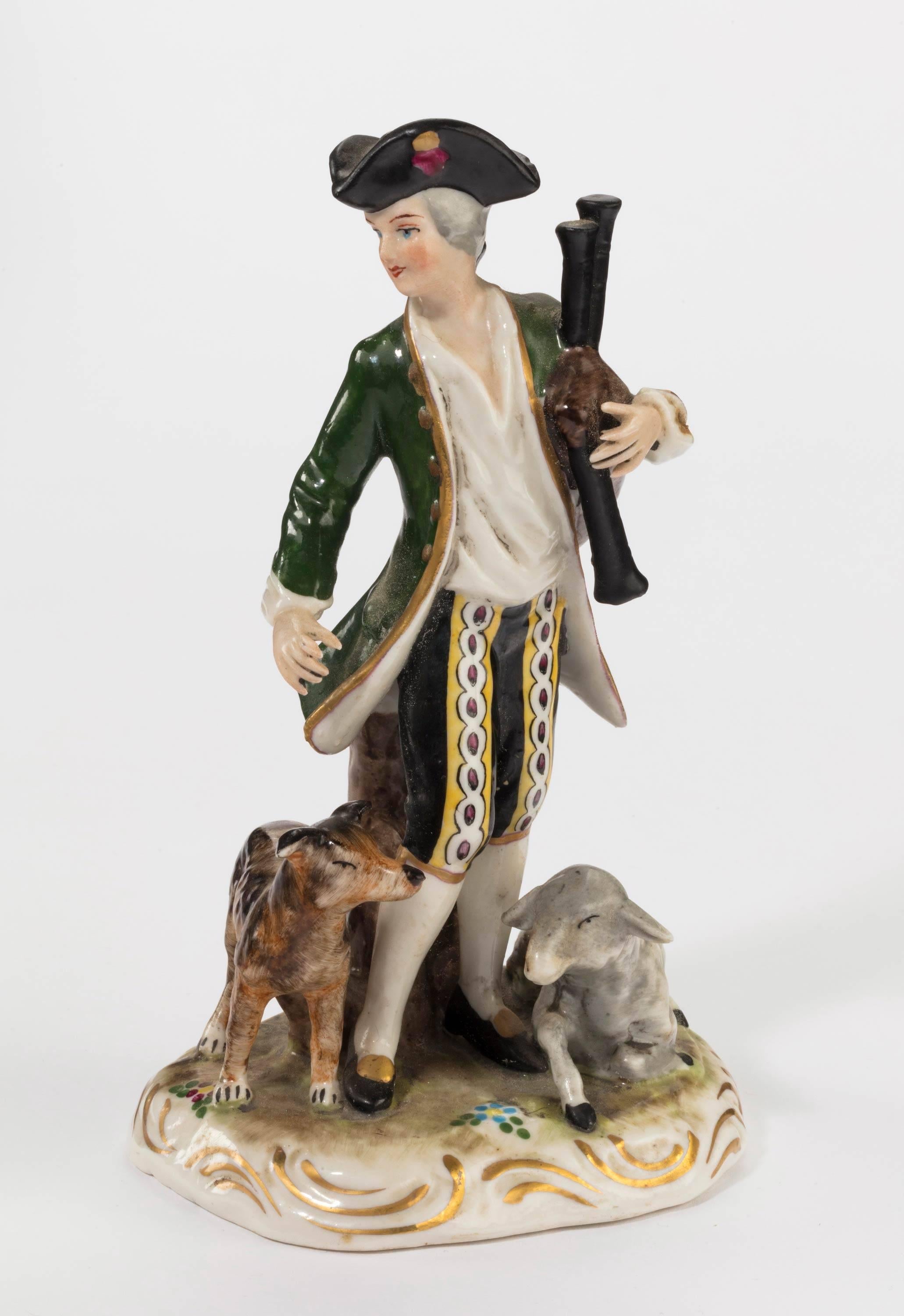 A pair of Continental porcelain figures of huntsman and animals. Marked as Meissen but probably Samson of Paris.