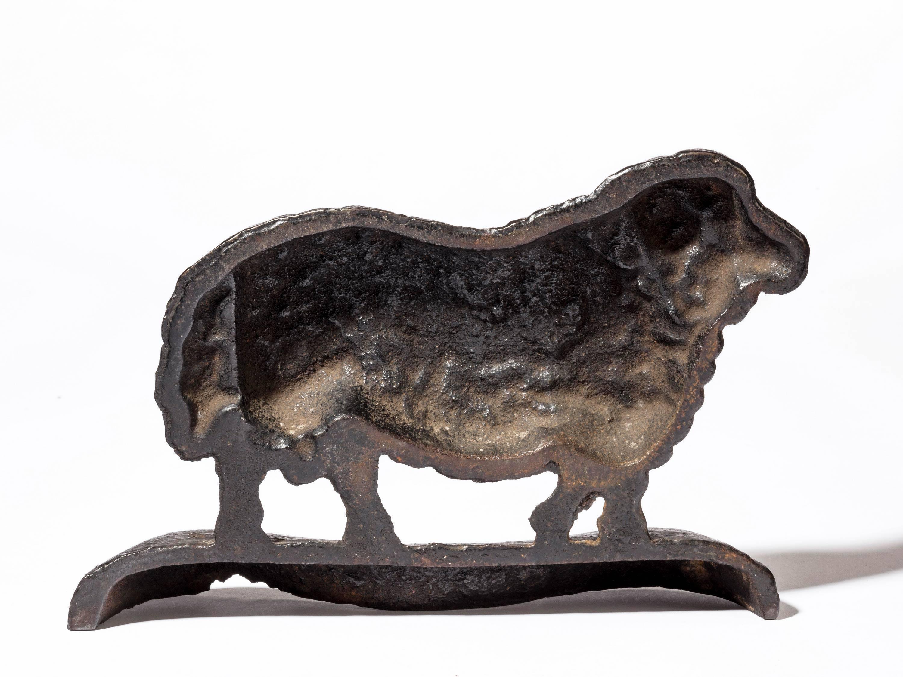A mid-19th century cast iron door stop in the form of a Ram. Original patination.