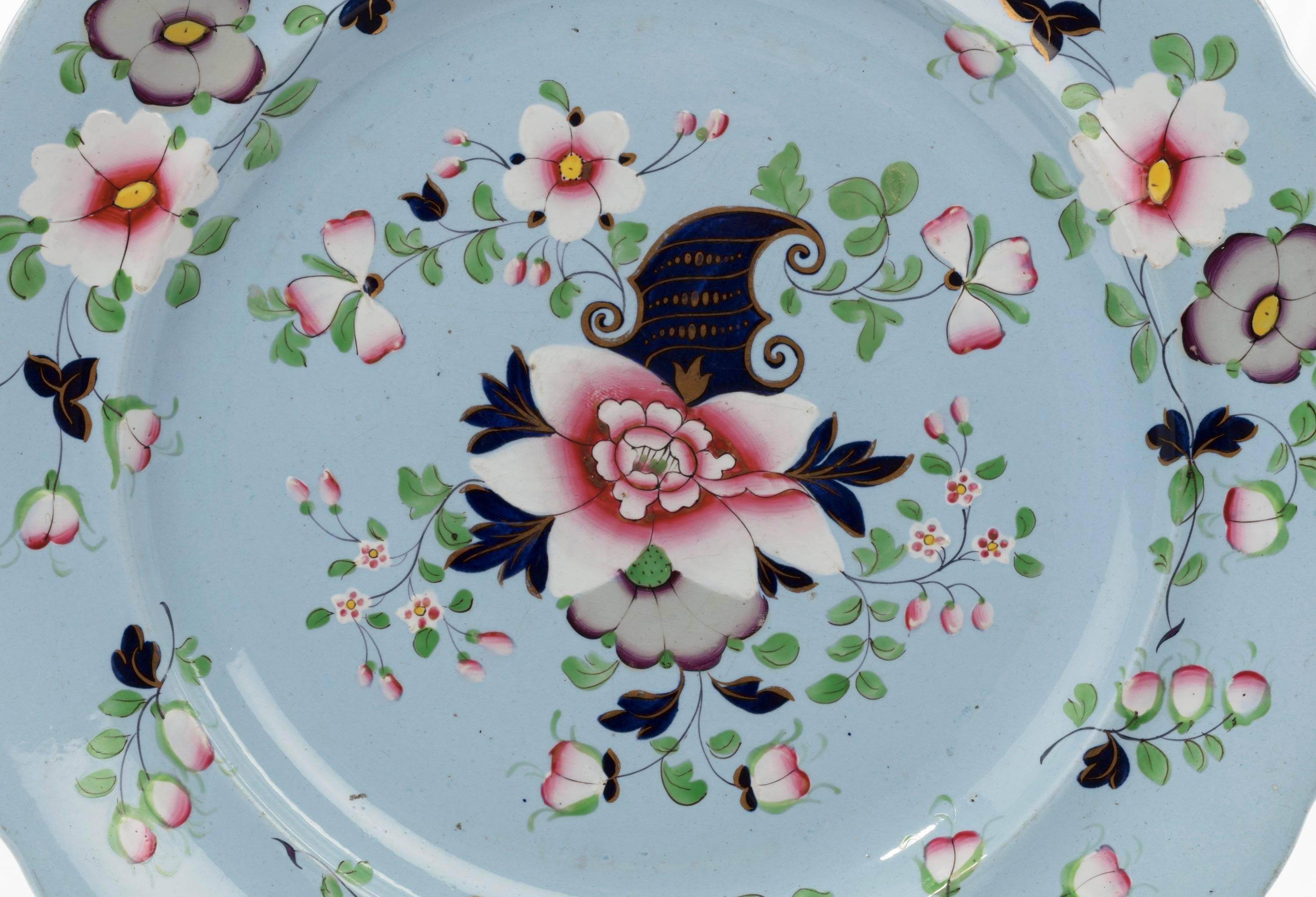 A pair of painted enameled gilded dinner plates.