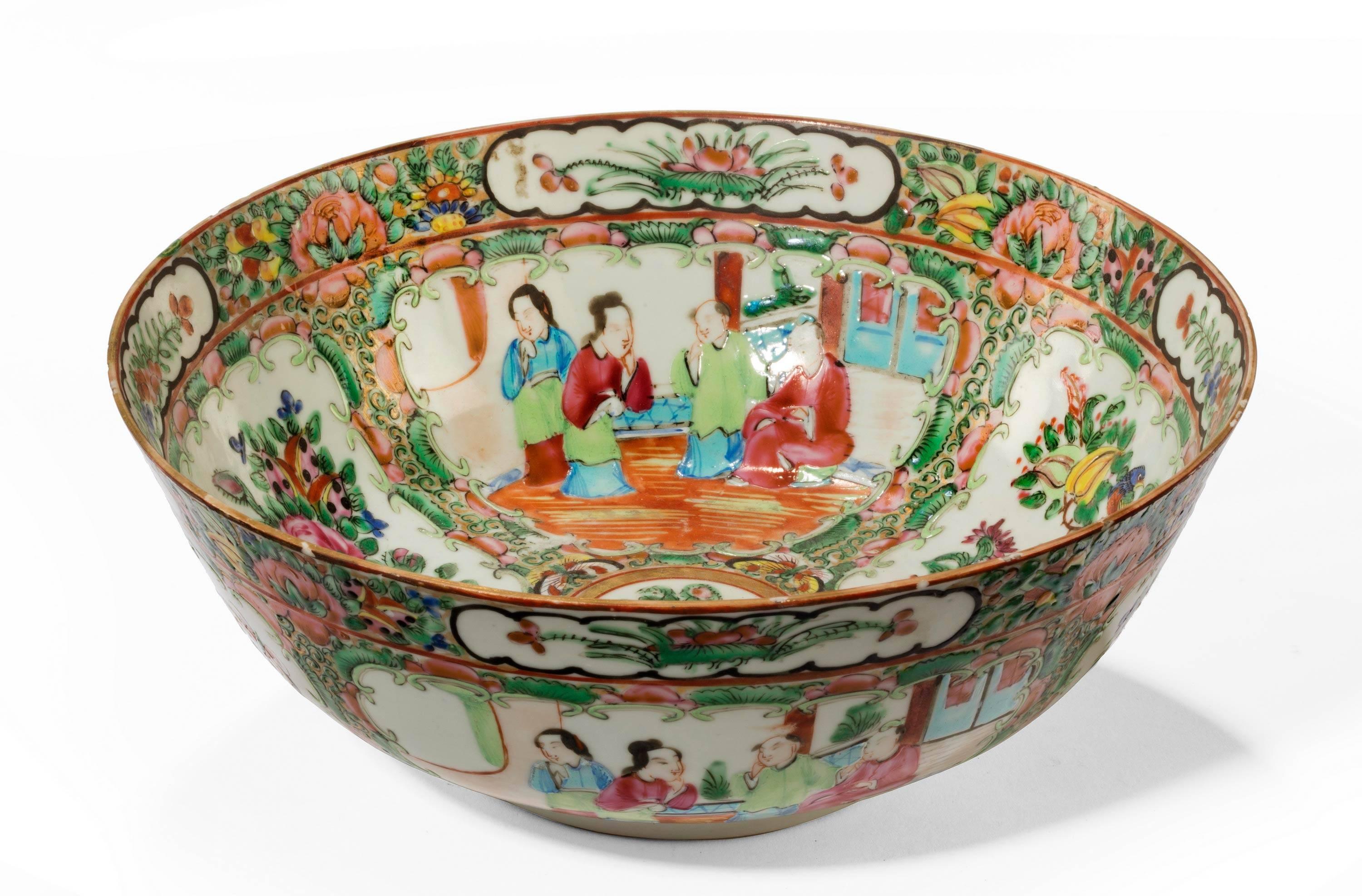 A finely decorated Cantonese enameled porcelain bowl. Occasionally referred to as famille verte. The interior heavily decorated with court scenes and reserved panels of flowers and foliage. The exterior with similar. Excellent unrubbed condition.