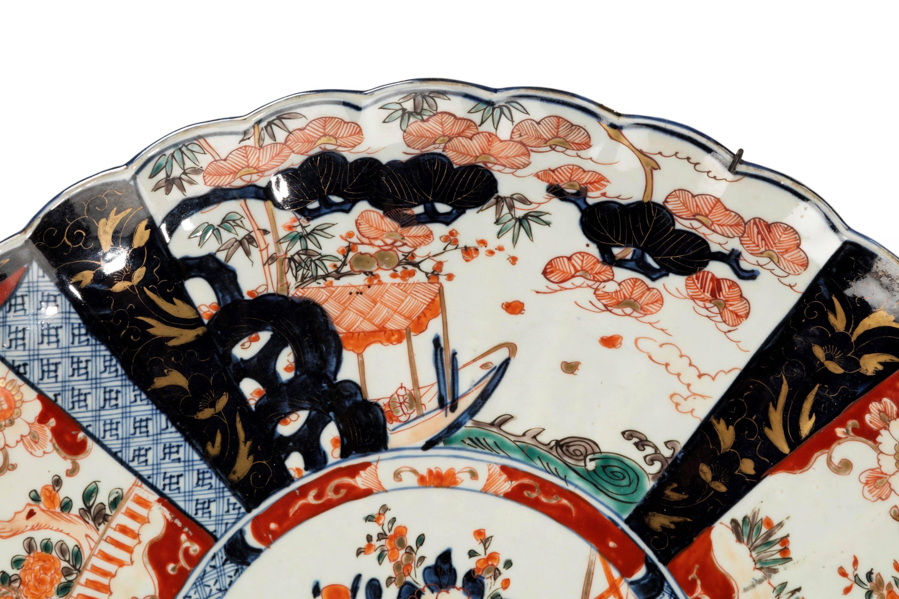A good mid-19th century Imari charger, with lobe edge decoration. Very fine condition including all the gilding.