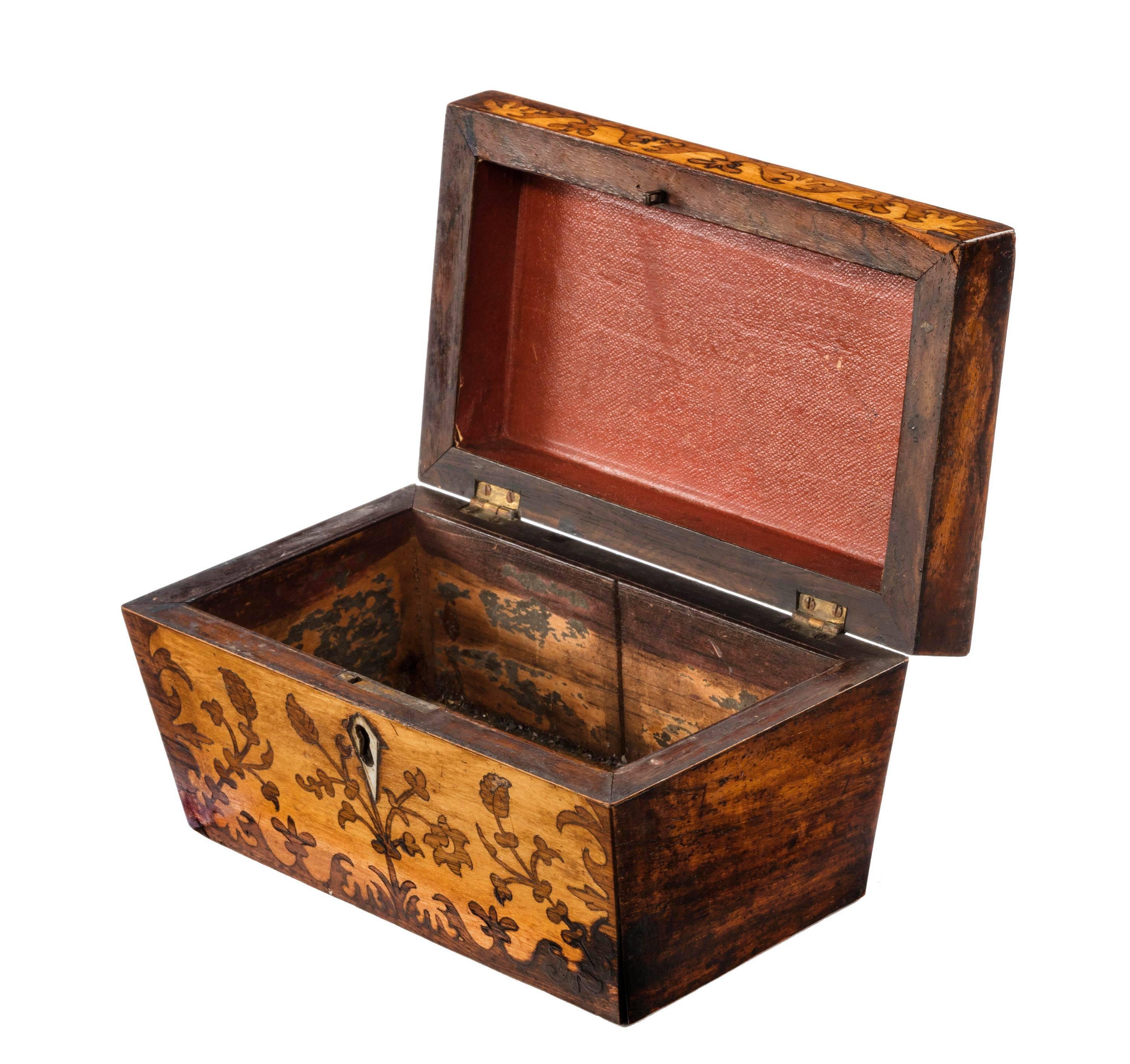 Regency period satinwood marquetry inlaid caddy with mother-of-pearl escutcheon. The interior now missing, but overall it is in excellent original condition.