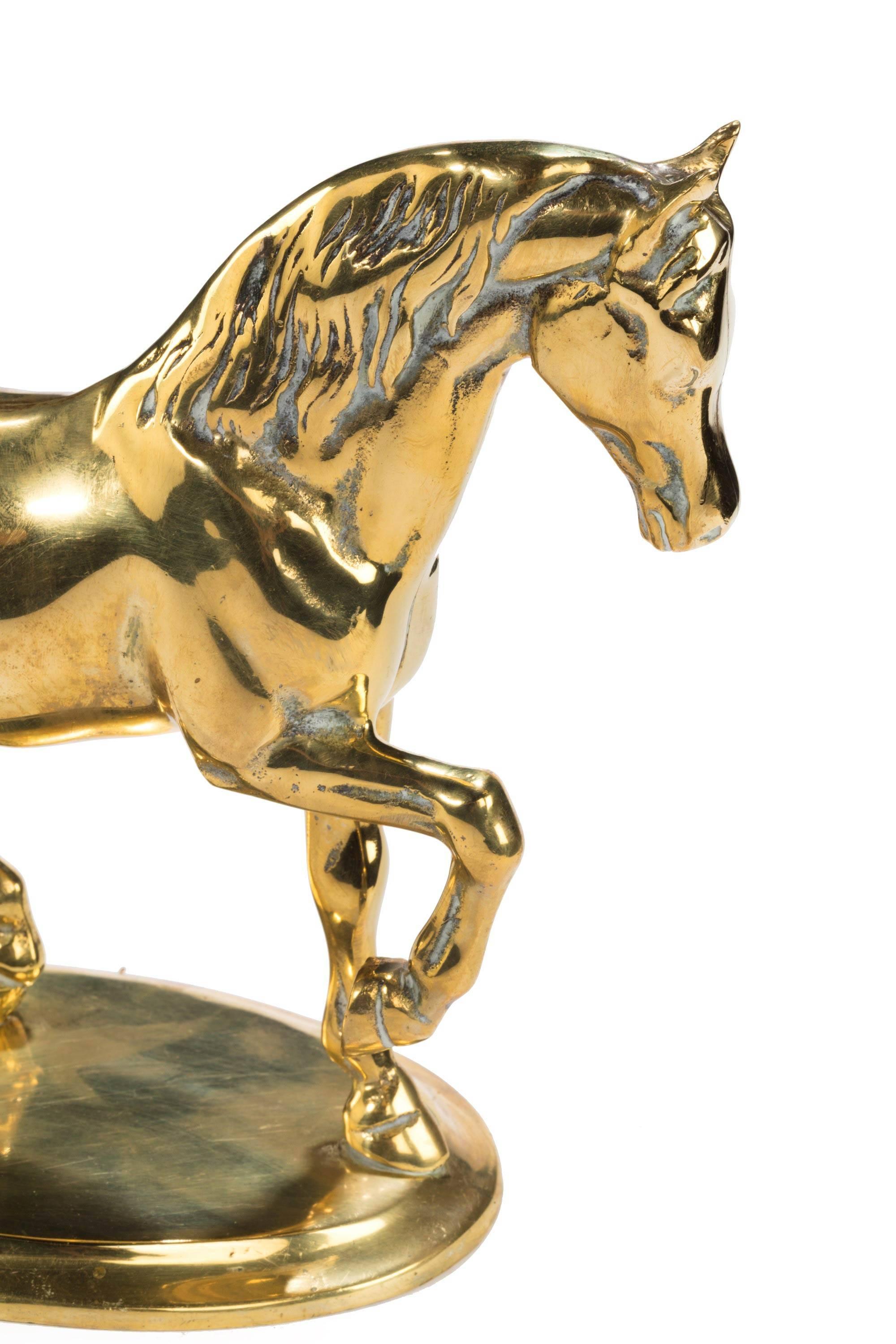 Well modelled late 19th century Continental brass horse with a raised foot.
