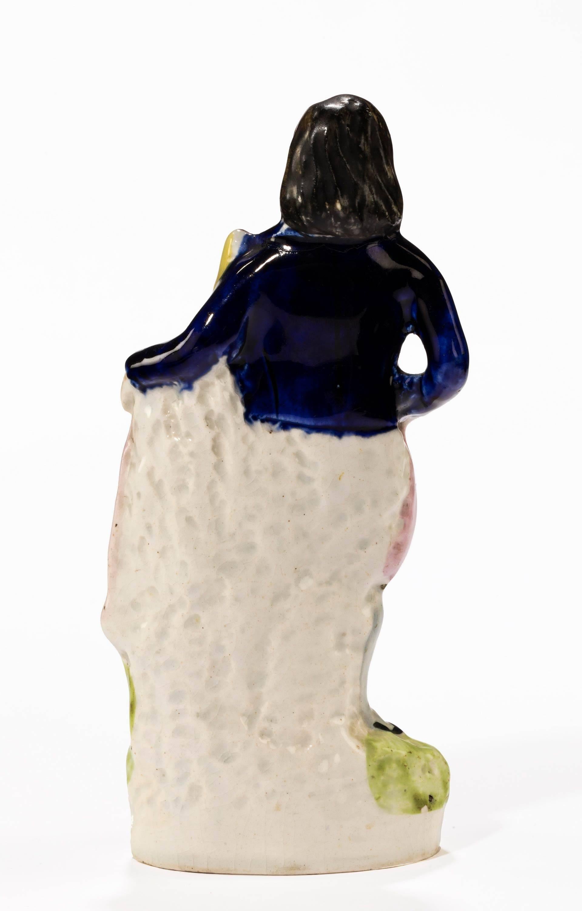 English Late 19th Century, Staffordshire Figure of a Young Lady Holding a Peacock