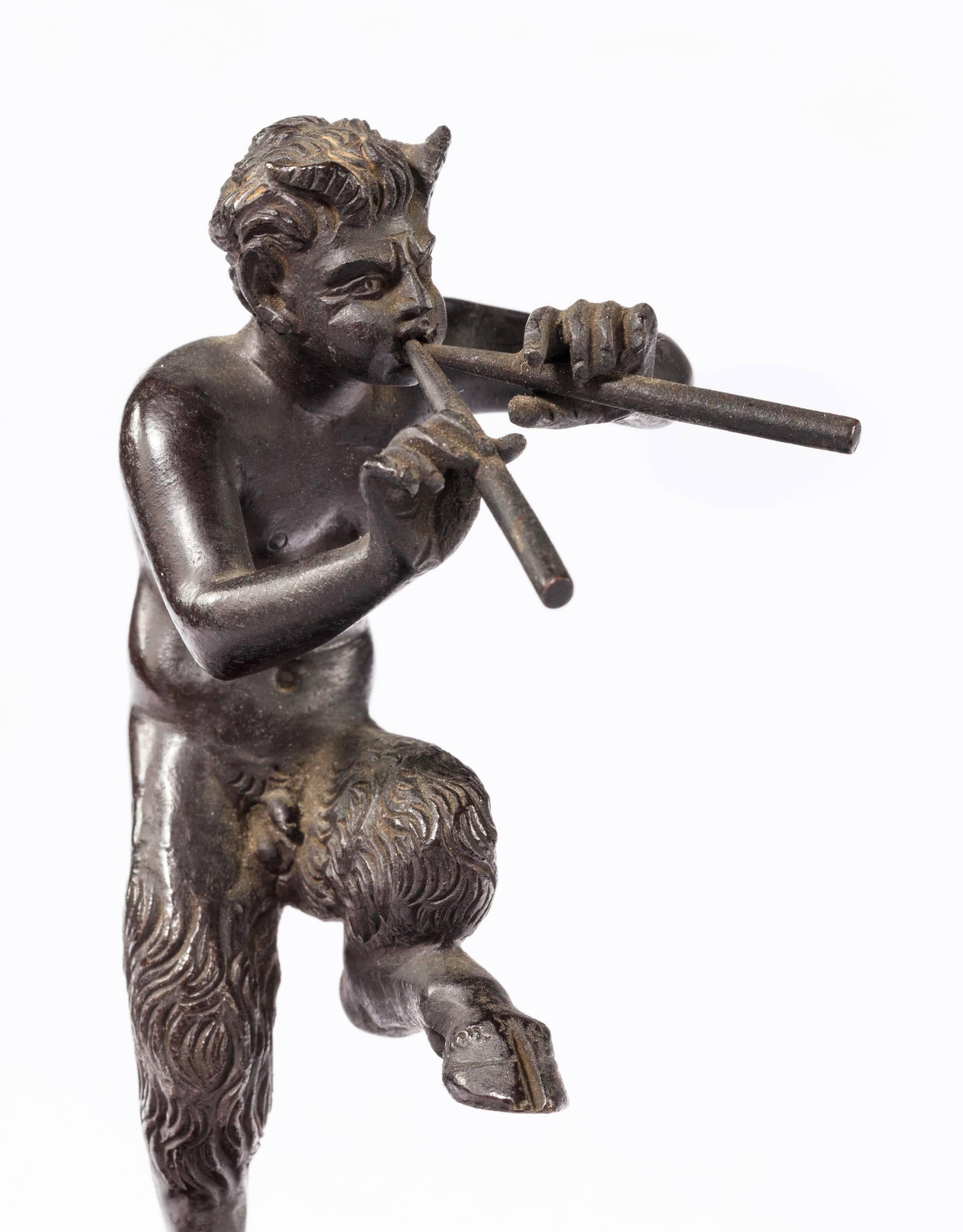 Early 19th century patinated bronze Grand Tour figure of a dancing fawn. On the original marble base. Well modelled.