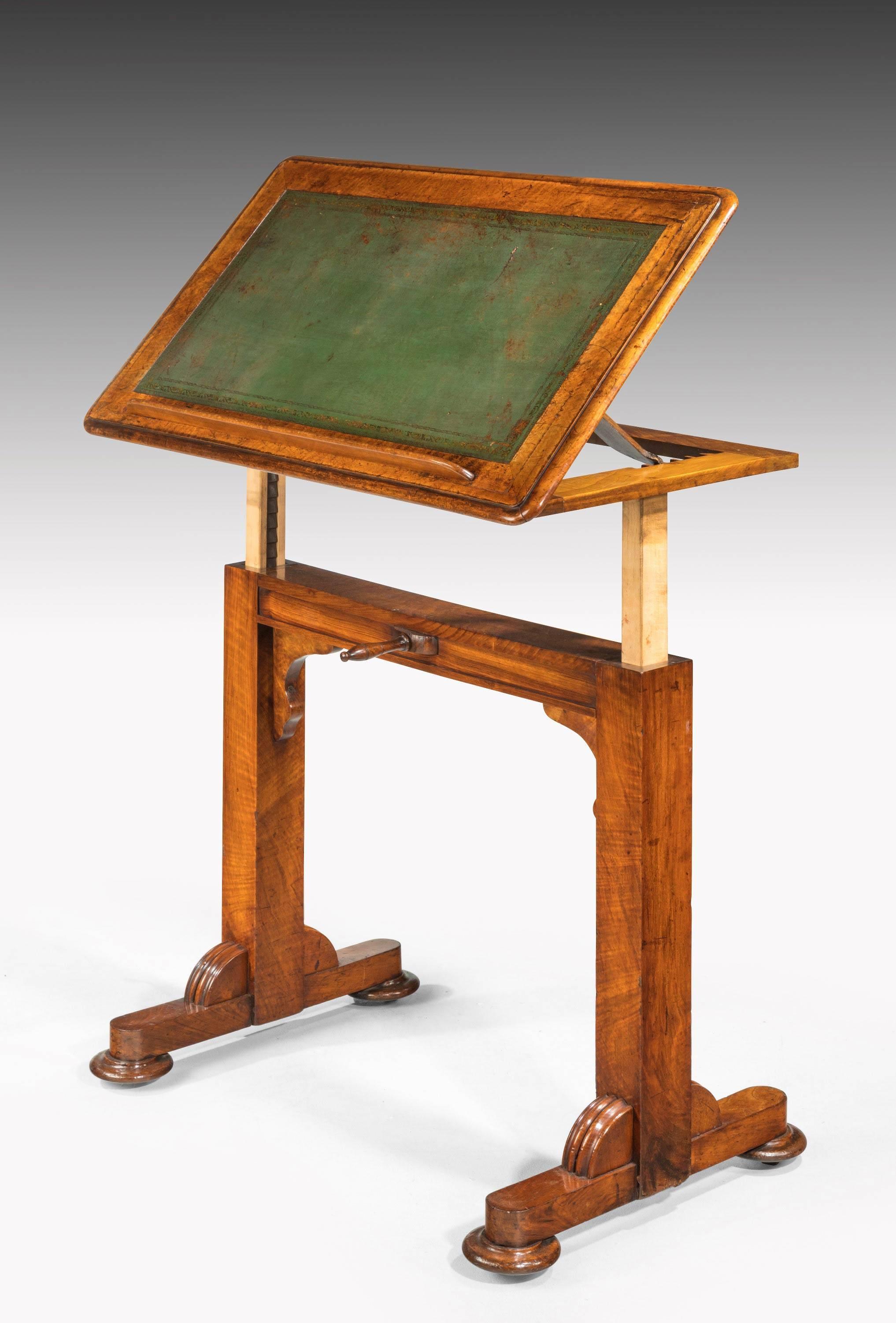 Late Regency period mahogany writing or reading table. On a moveable and adjustable ratchet. On substantial turned supports. Involving a sliding height mechanism. 

The height being able to adjust to 51 inches.