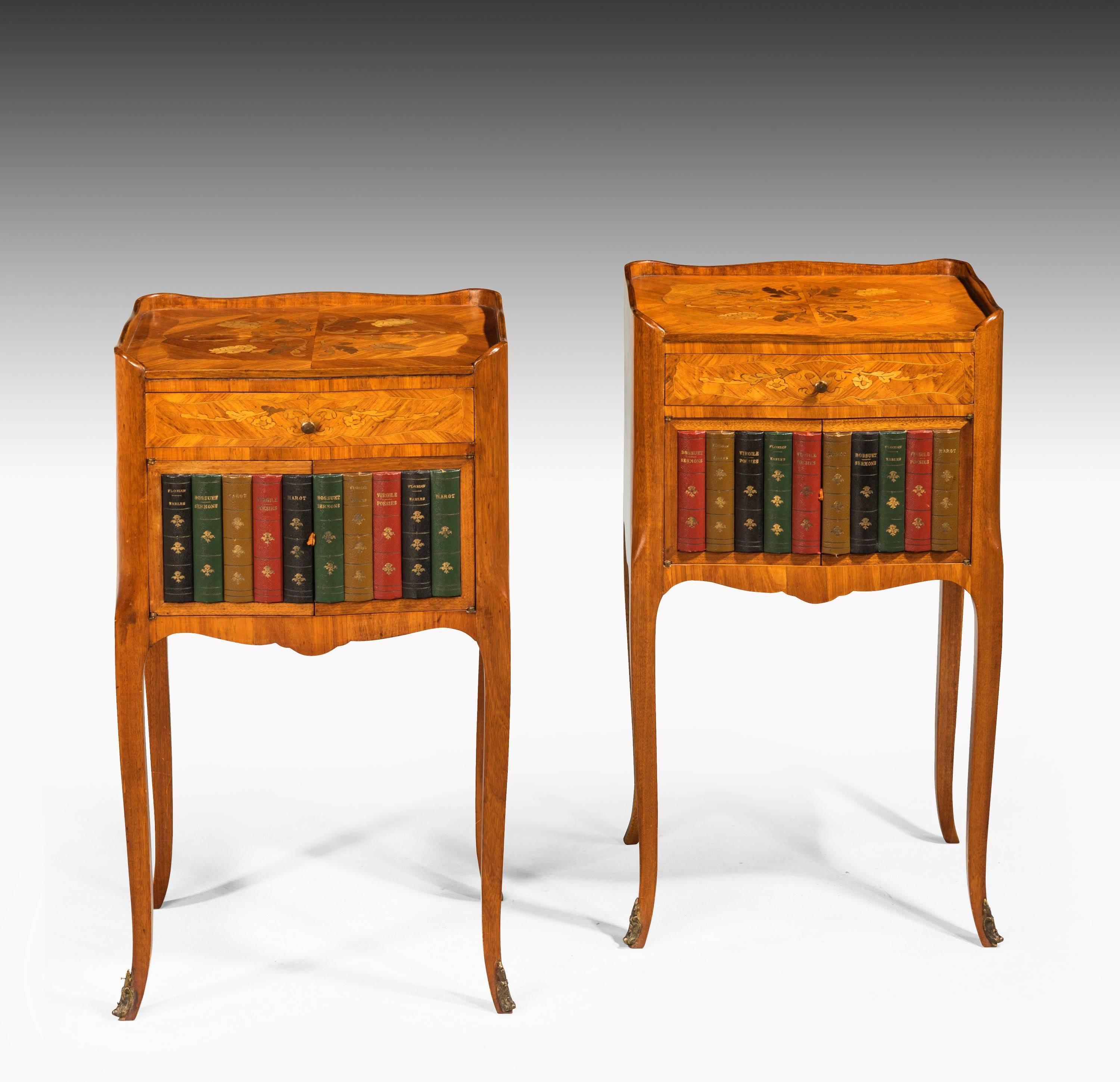 A most attractive pair of kingwood and marquetry night cabinets. On gentile cabriole supports. Terminating in gilt bronze sabots. Faded even honey color, French.