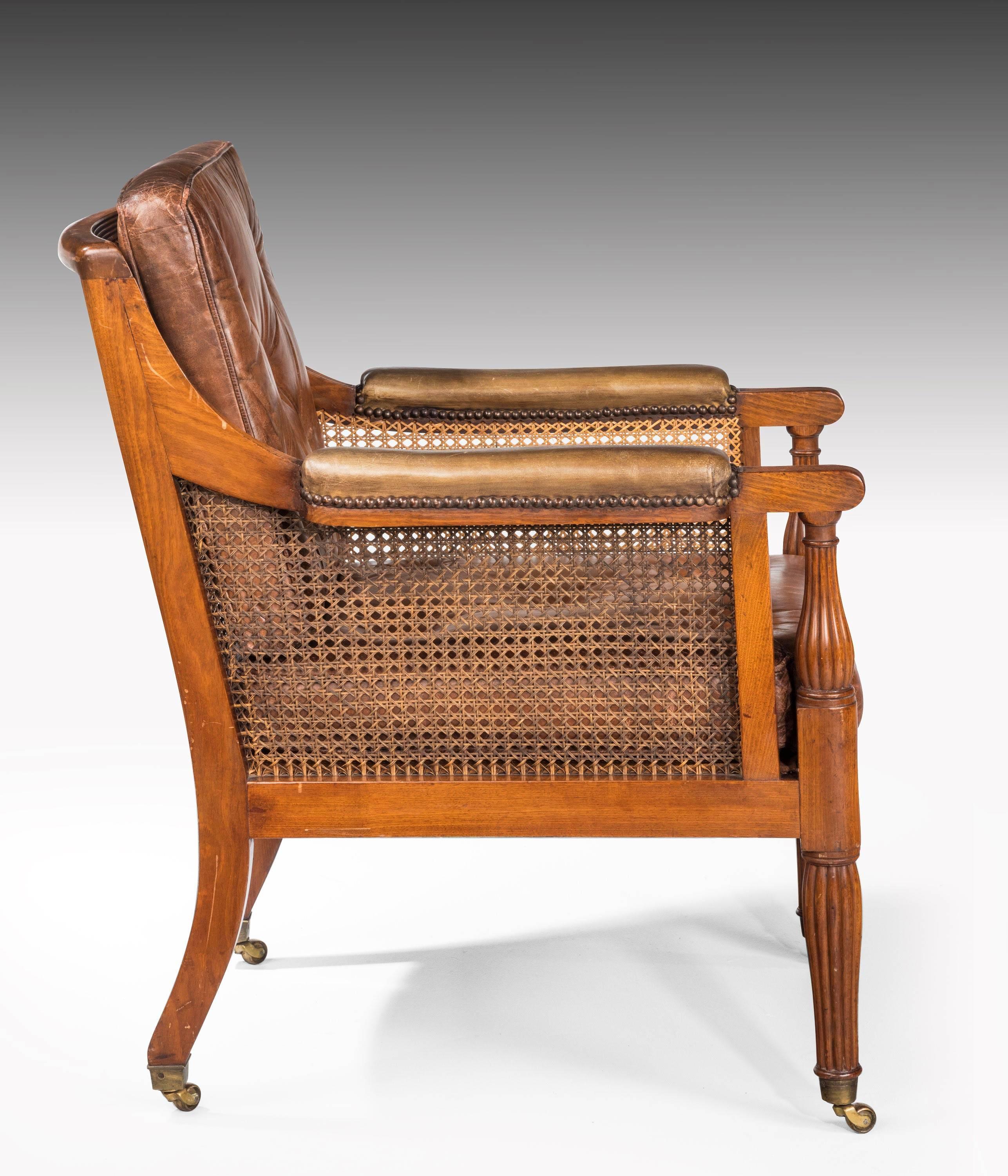 English Pair of Regency Period Bergere Armchairs Retaining the Original Canework
