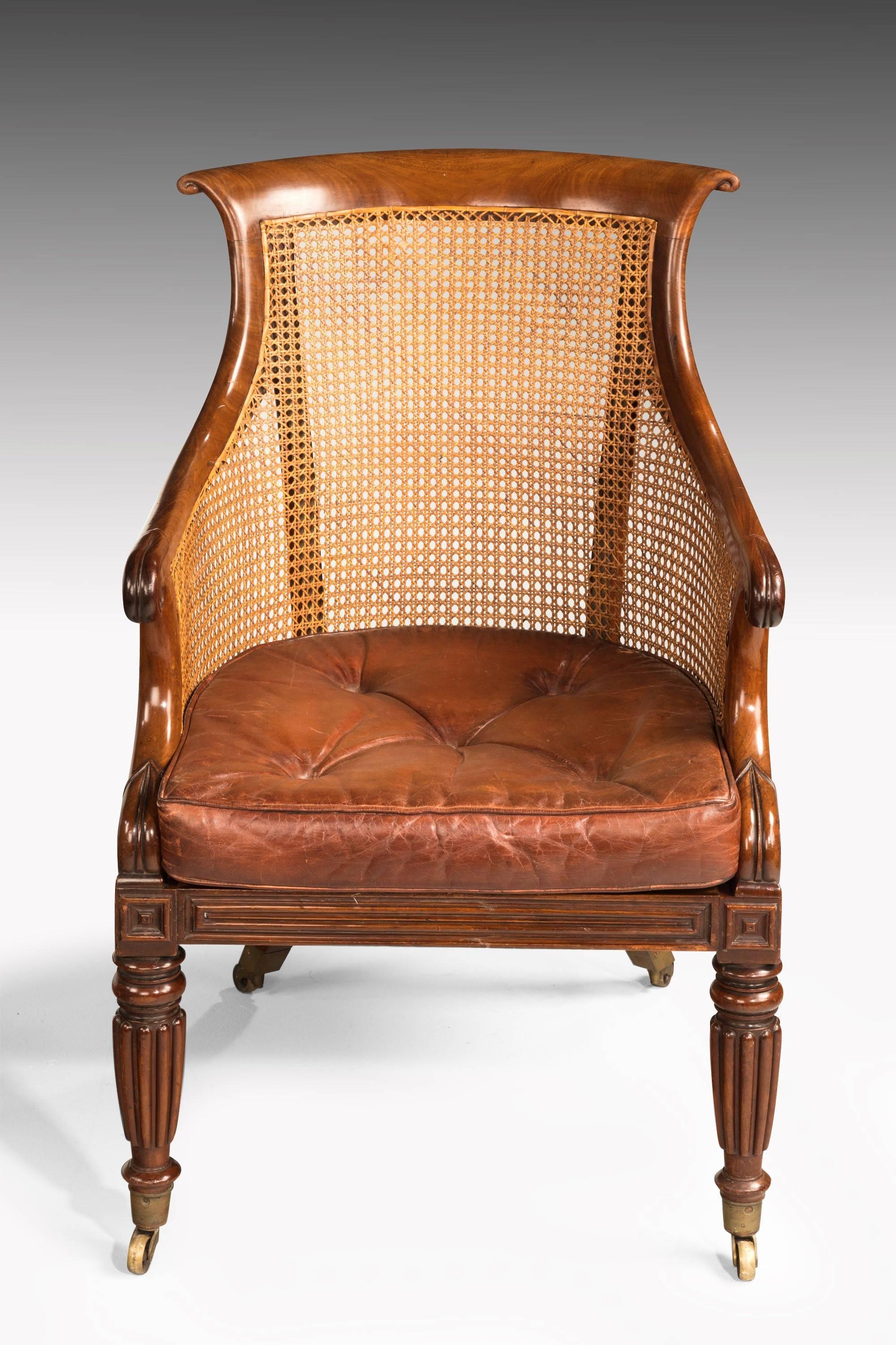 19th Century Pair of Regency Period Bergère Library Chairs with Swept Arms
